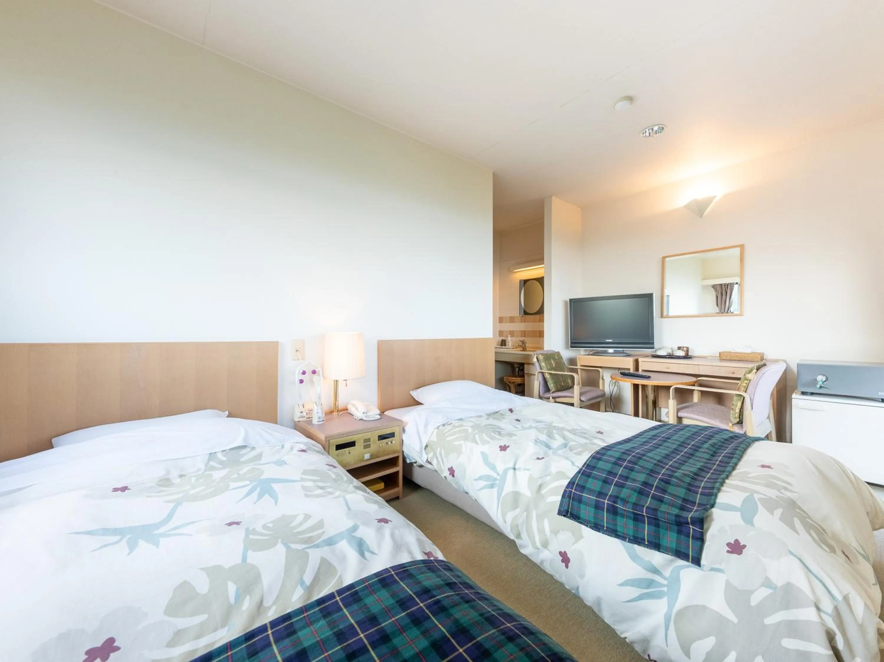 Bed in Tabist Hotel Iyashi no Sato