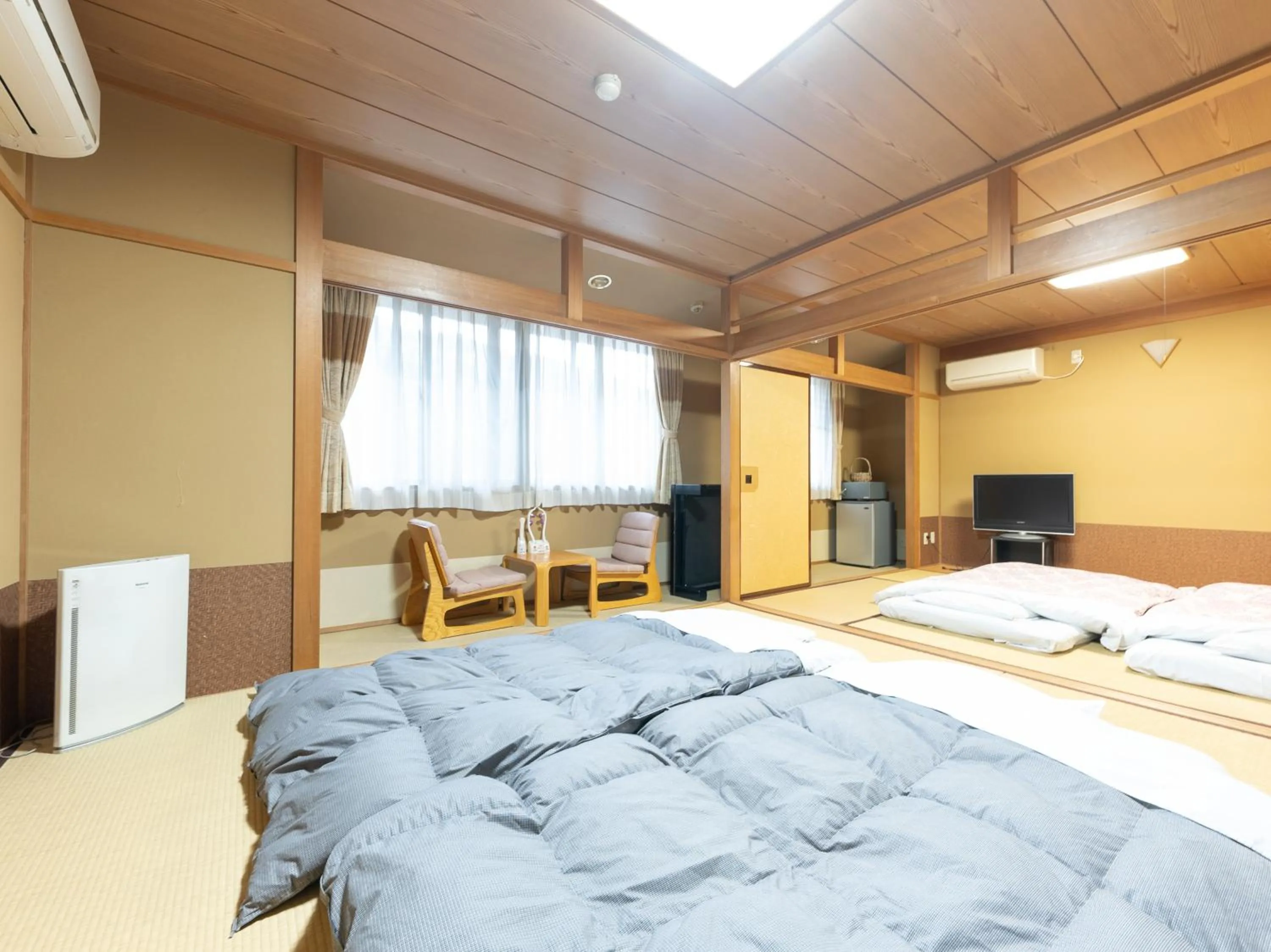 Bed in Tabist Hotel Iyashi no Sato