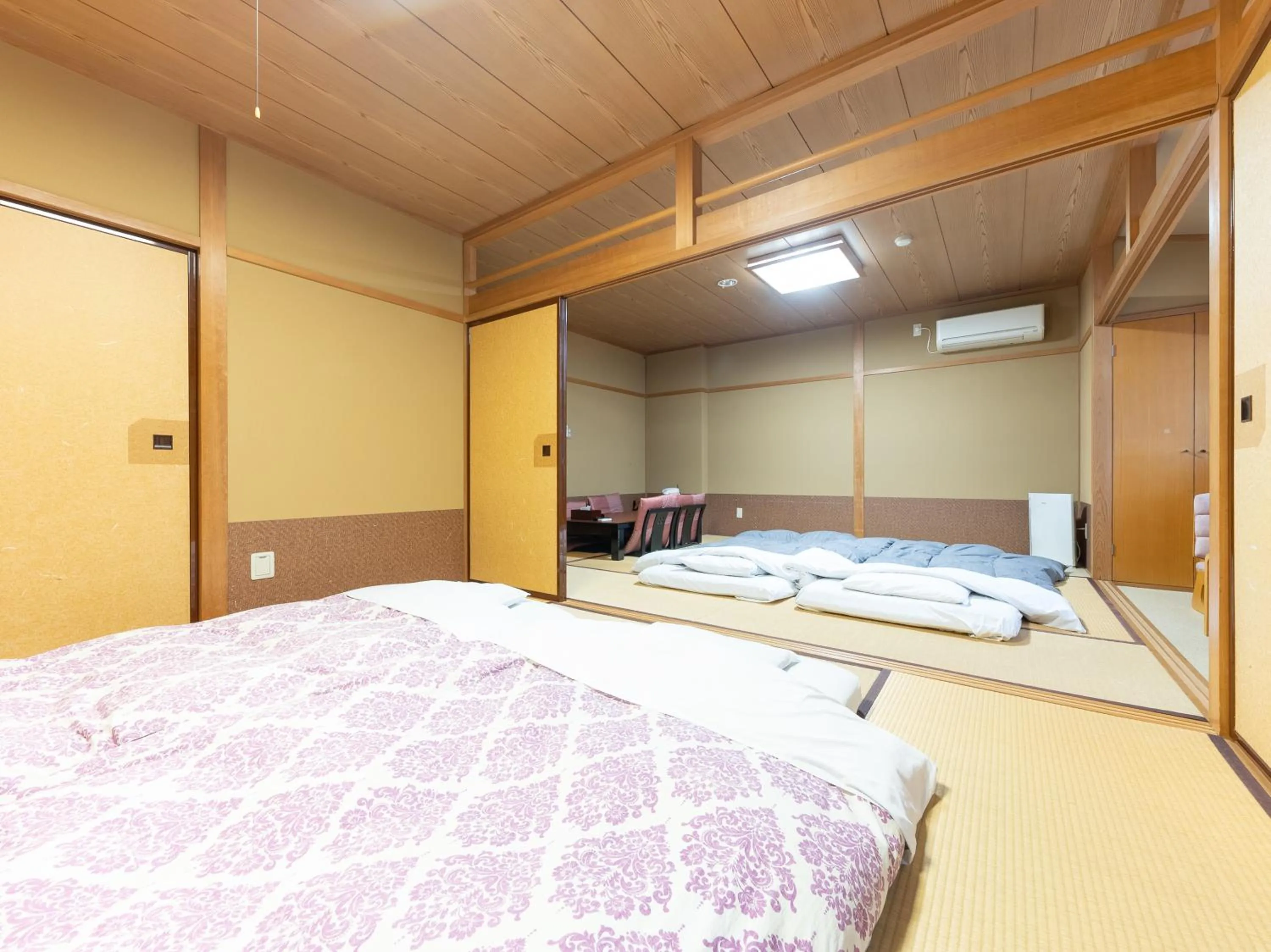 Bed in Tabist Hotel Iyashi no Sato
