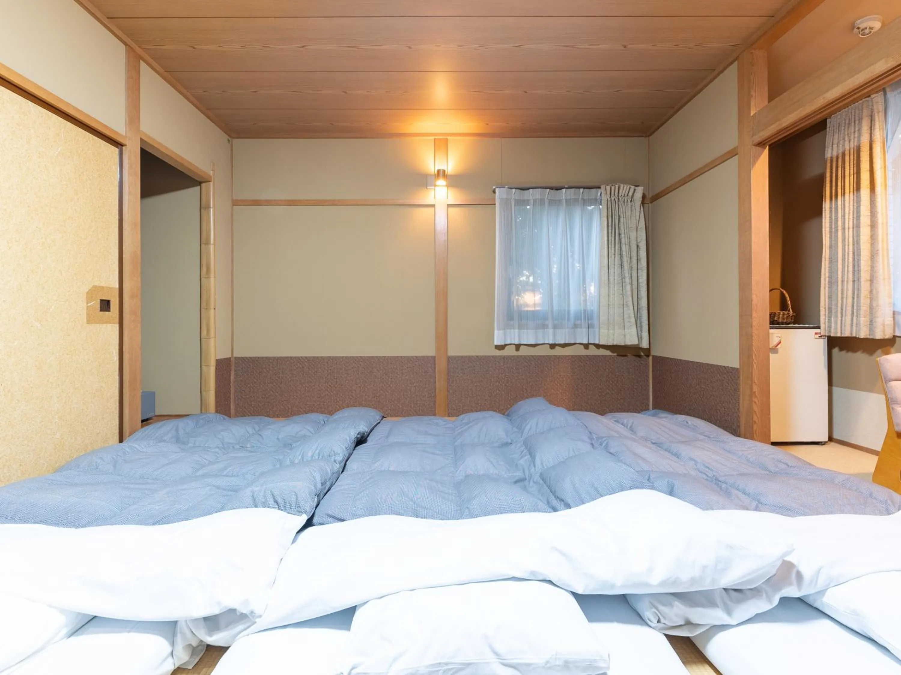 Bed in Tabist Hotel Iyashi no Sato