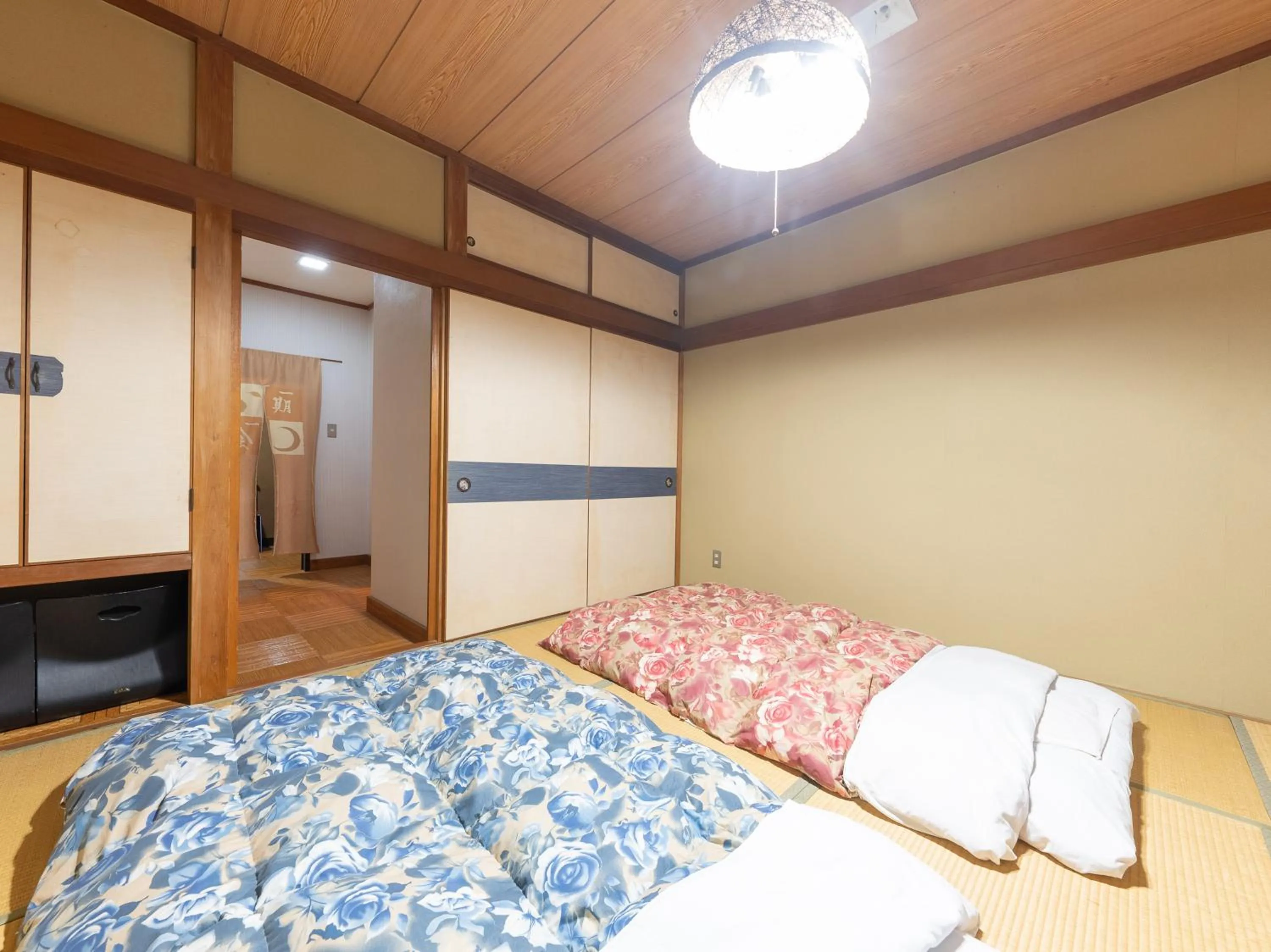 Bed in Tabist Hotel Iyashi no Sato