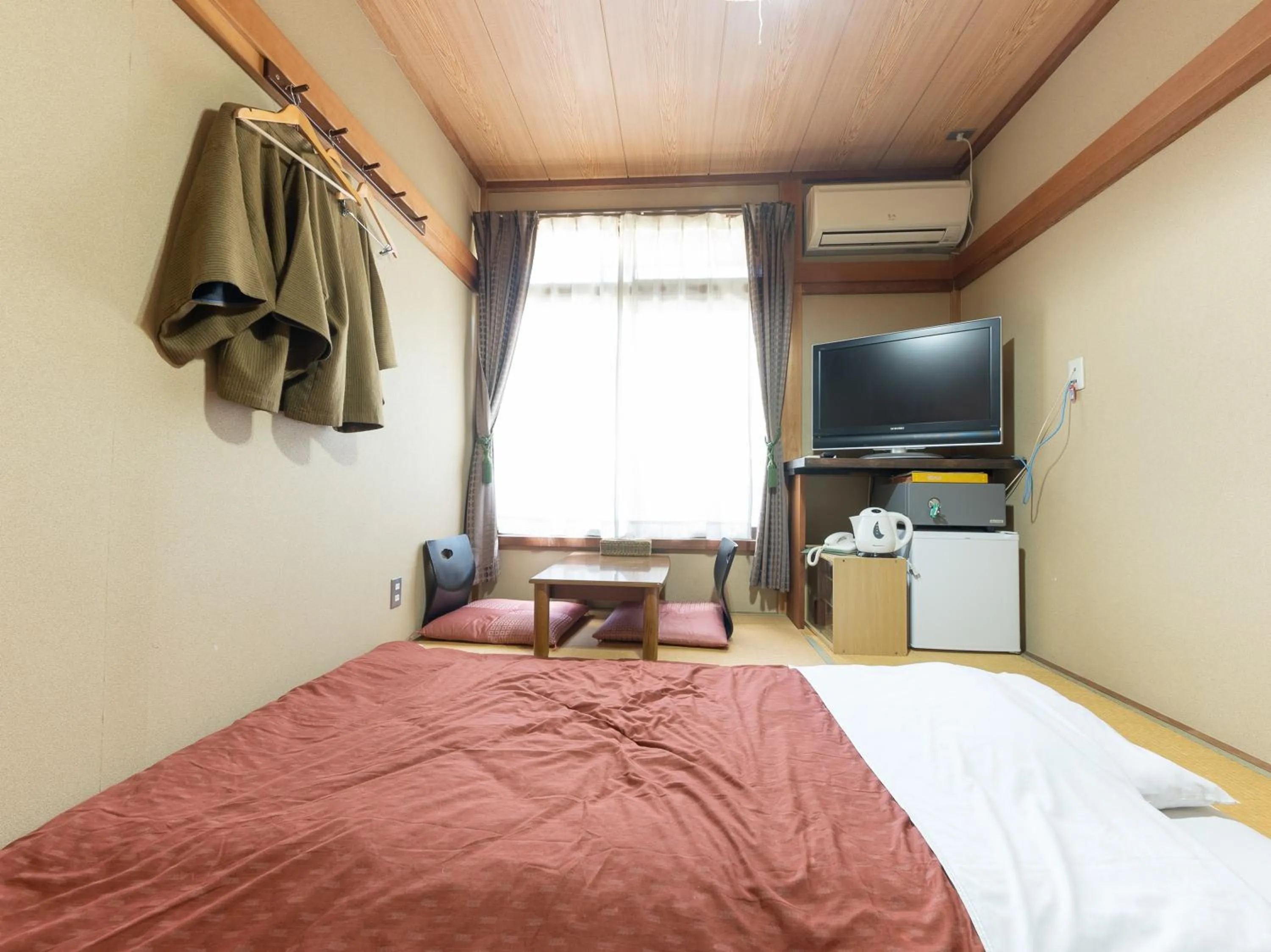 Bed in Tabist Hotel Iyashi no Sato