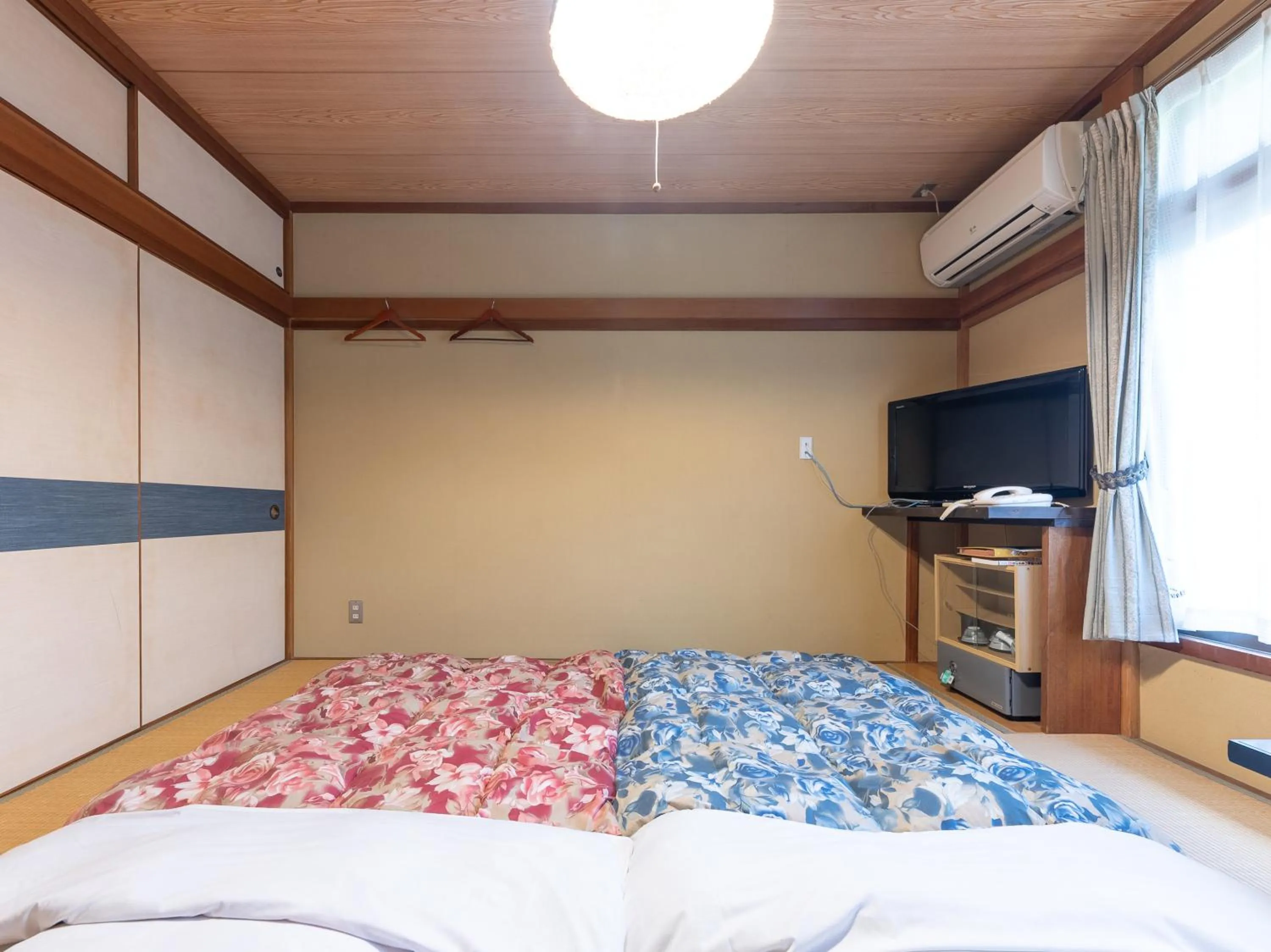 Bed in Tabist Hotel Iyashi no Sato