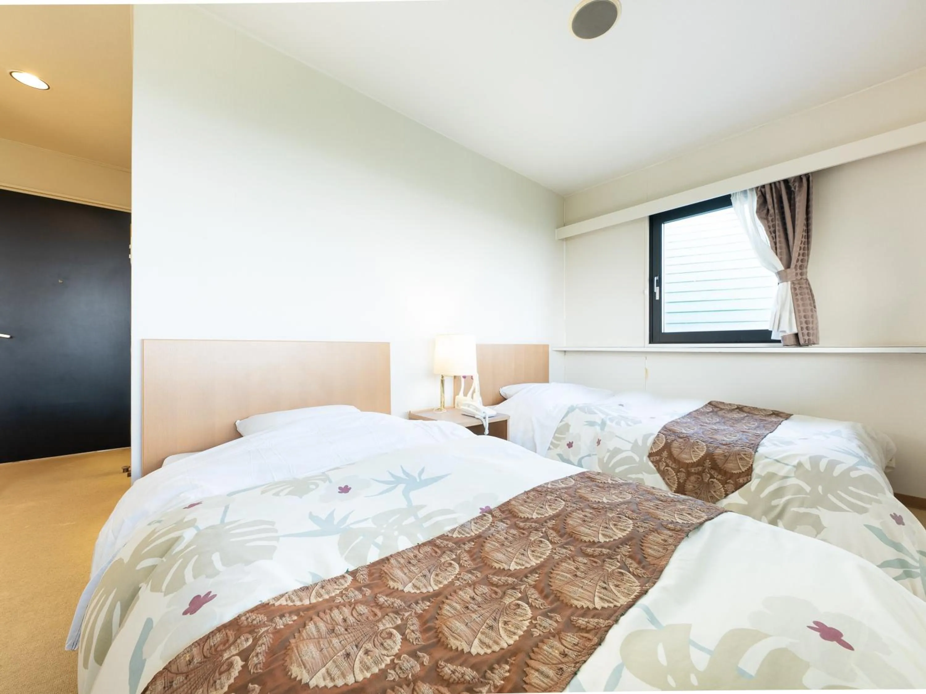 Bed in Tabist Hotel Iyashi no Sato