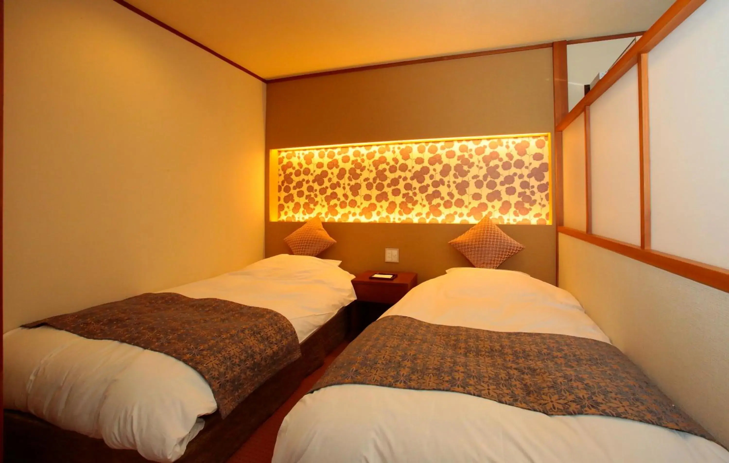 Property logo or sign, Bed in Itsuura Kanko Hotel Property logo or sign, Bed in Itsuura Kanko Hotel