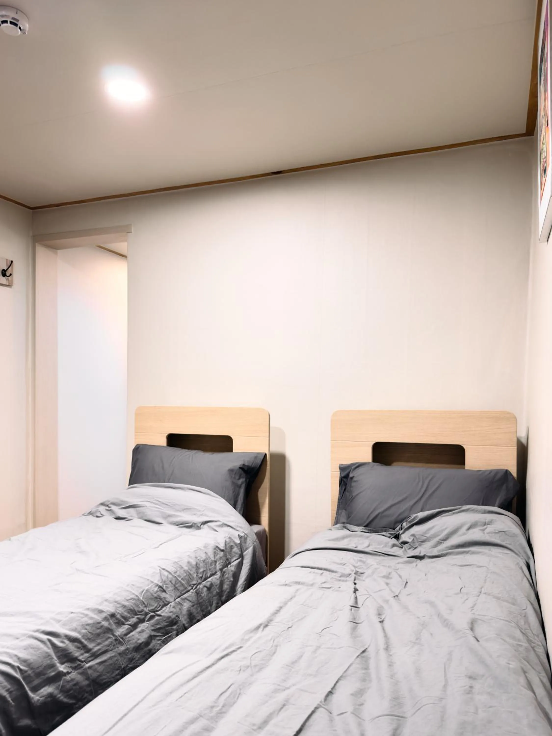 Annex wing Twin bed room with private bathroom outside in Hithere guesthouse