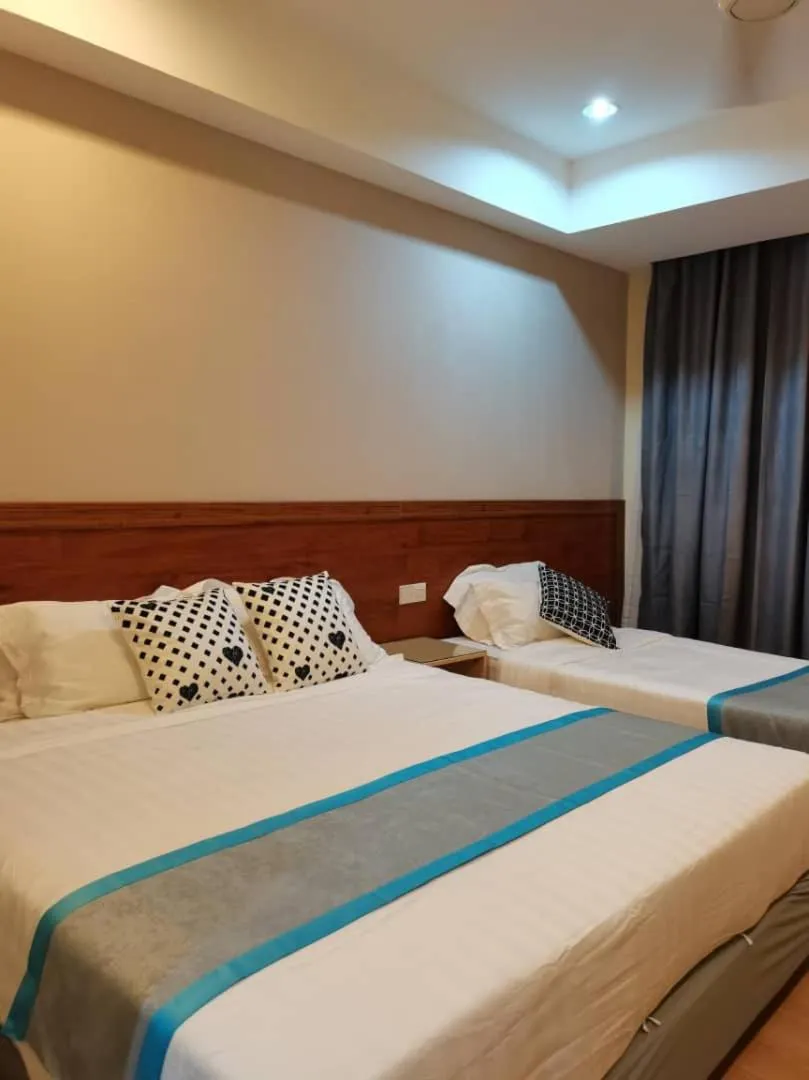 Bed in TD CAPITAL HOTEL