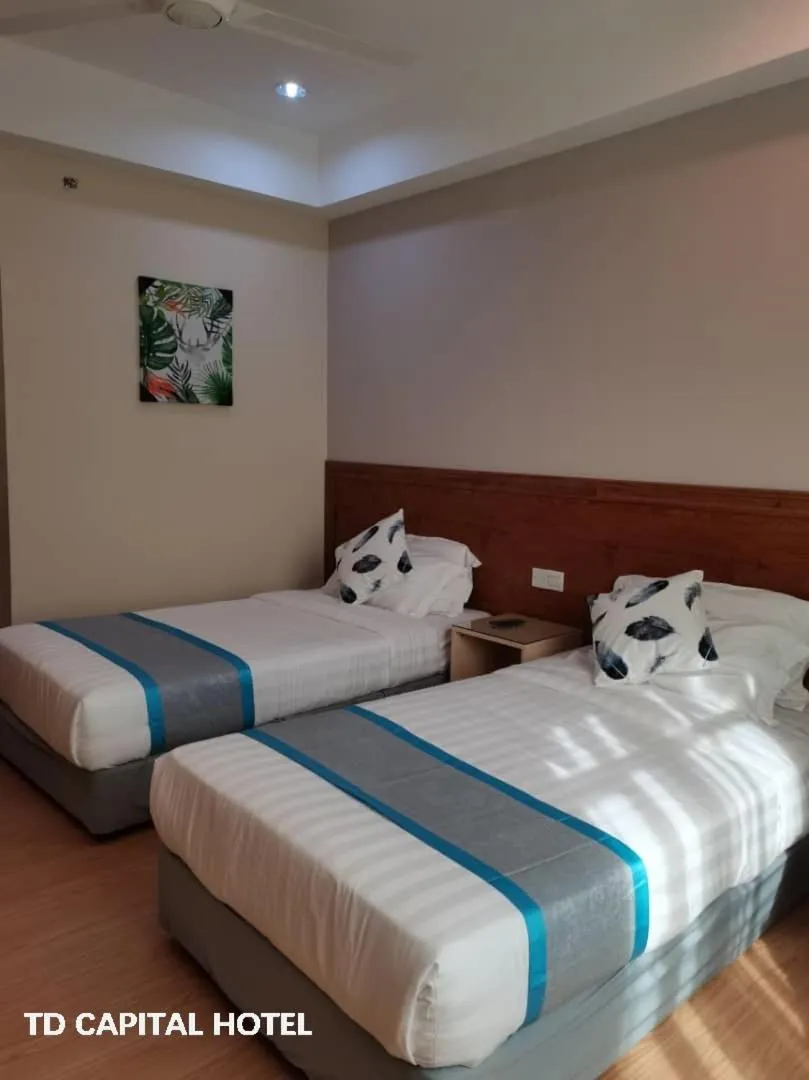 Bed in TD CAPITAL HOTEL