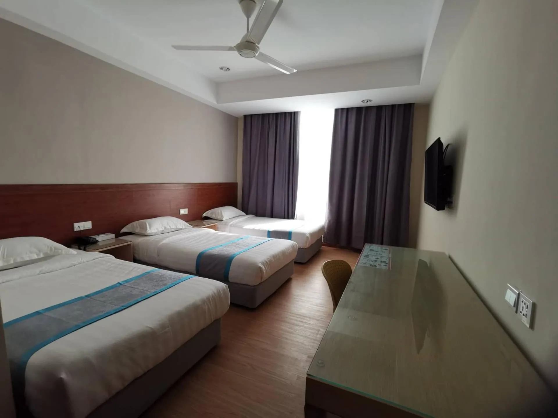 Bed in TD CAPITAL HOTEL