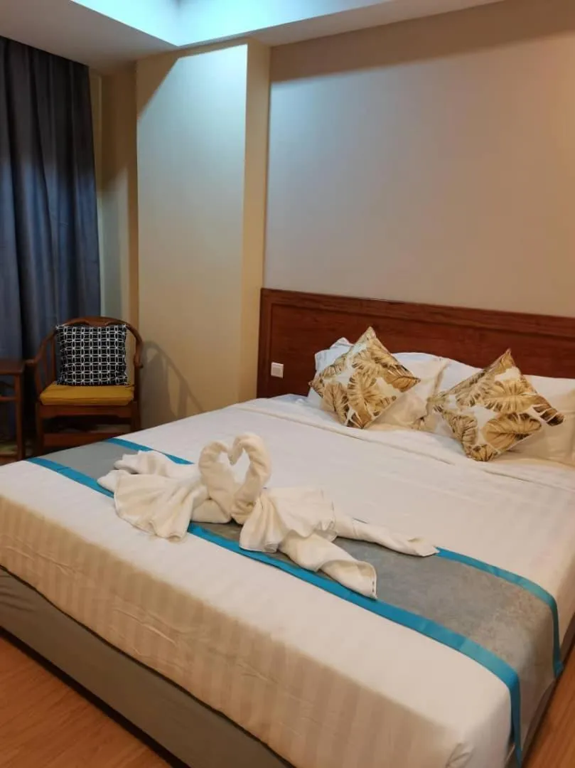 Bed in TD CAPITAL HOTEL