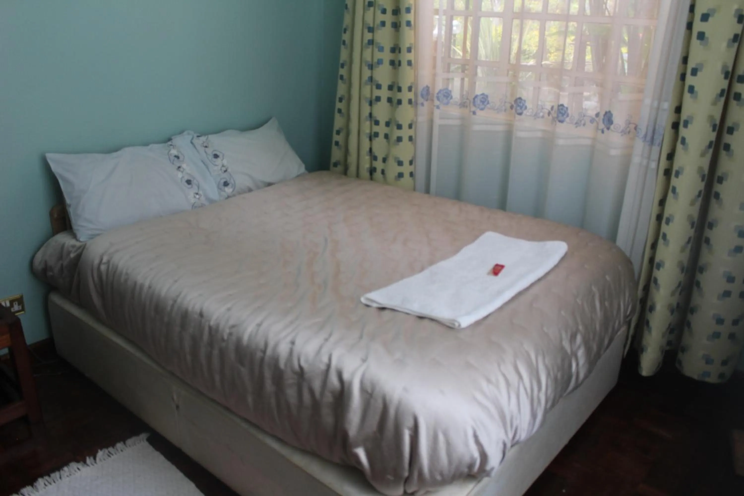 Bed in Tranquil Homestays