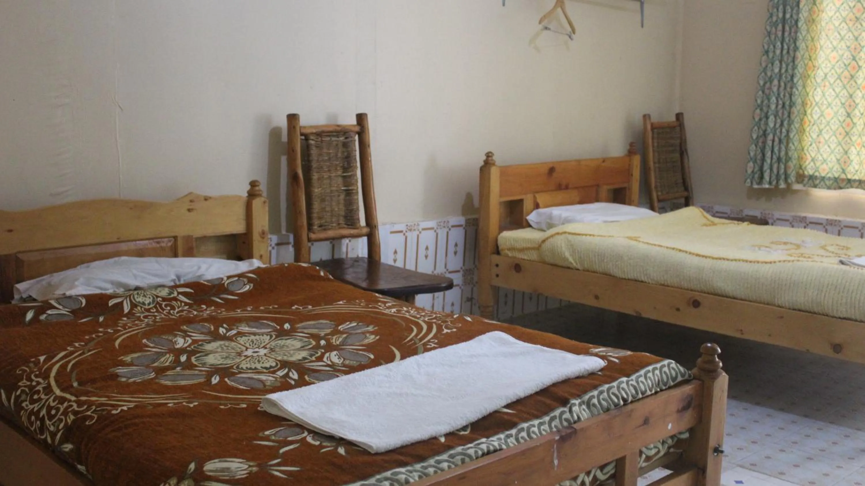 Bed in Tranquil Homestays