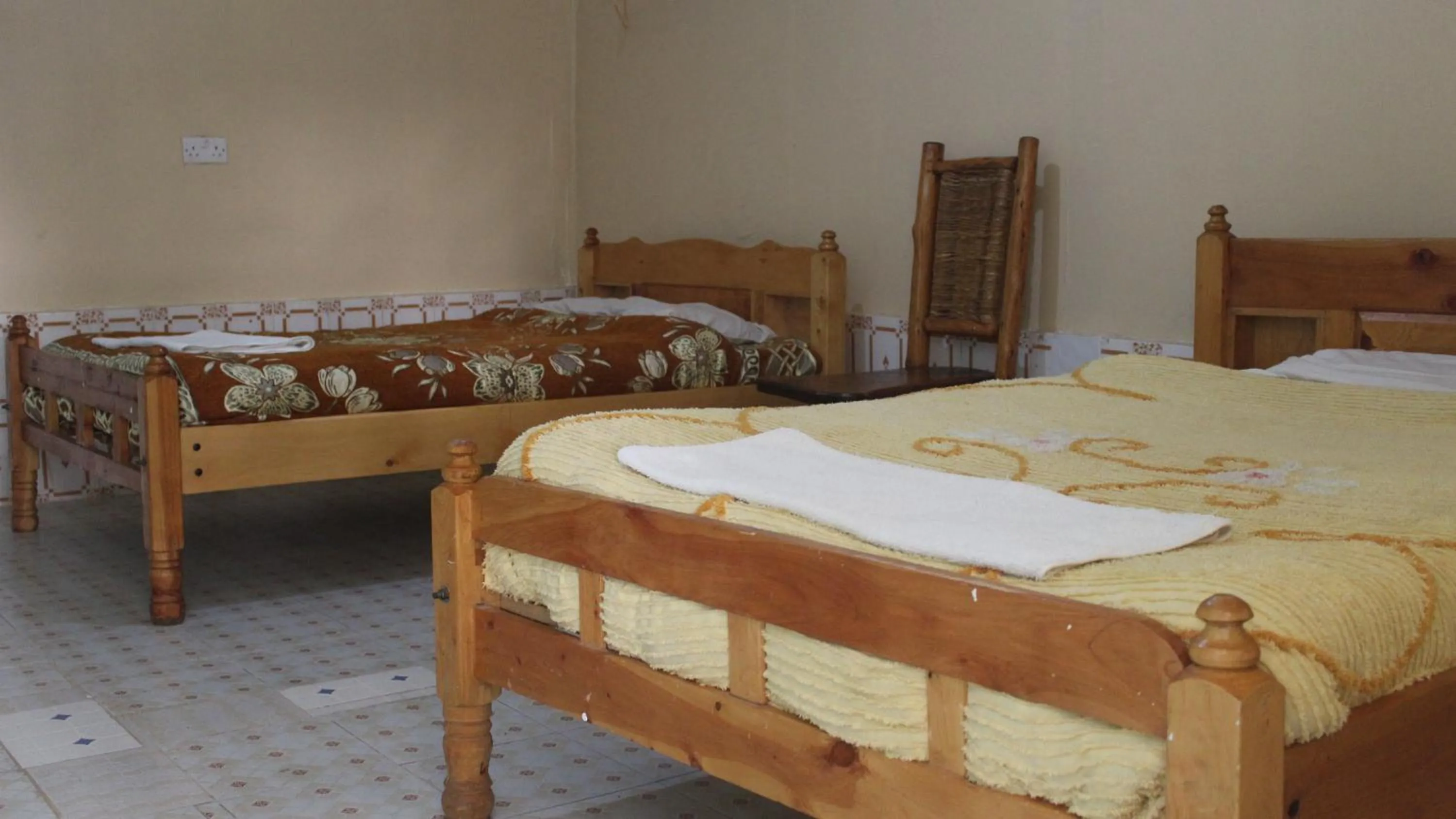 Bed in Tranquil Homestays