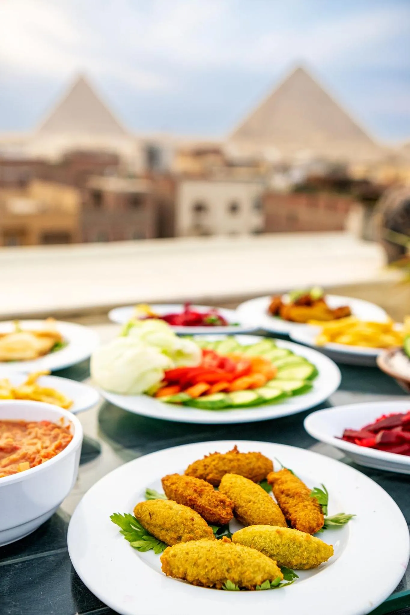 Restaurant/places to eat in Hassan Pyramids Hotel & free access Rooftop & airport pickup