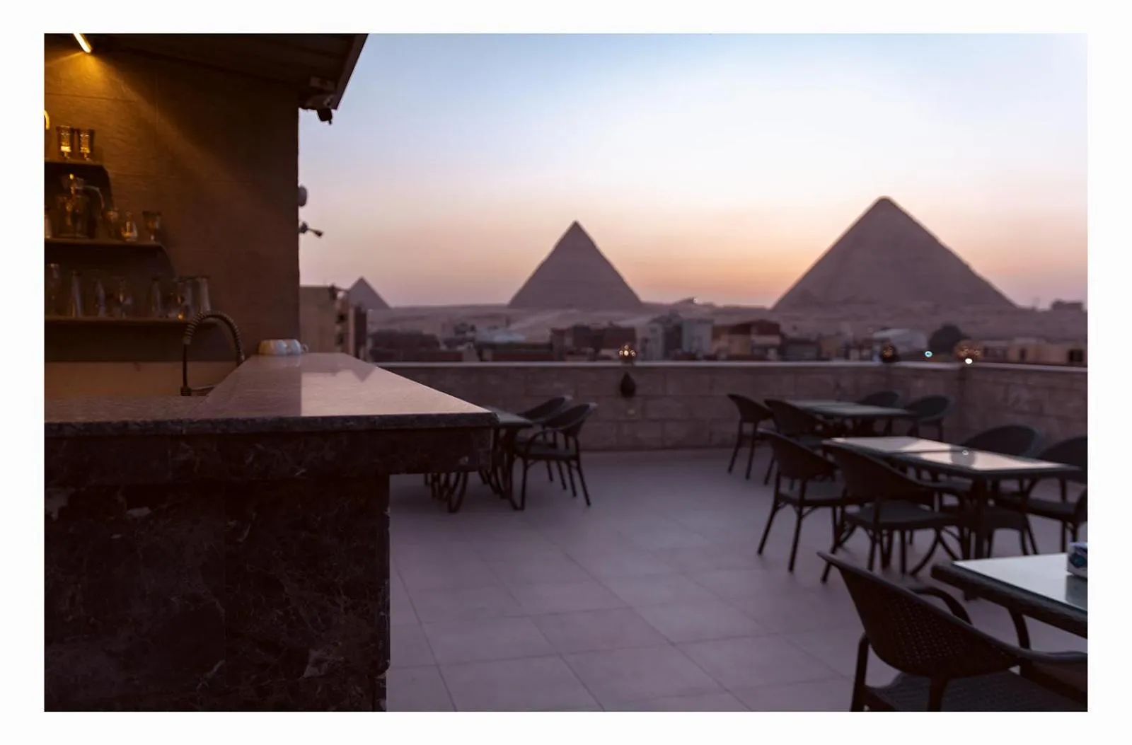 Restaurant/places to eat in Hassan Pyramids Hotel & free access Rooftop & airport pickup