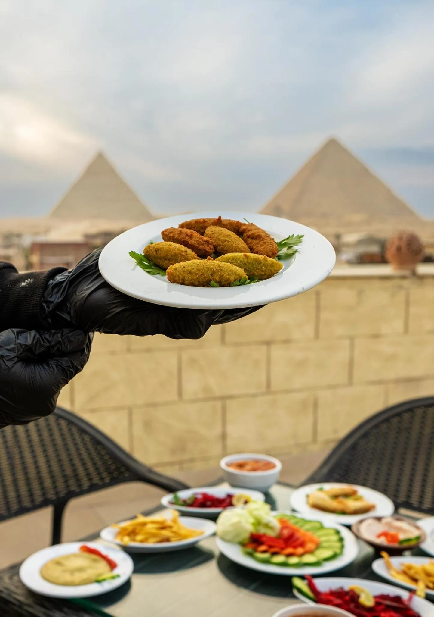 Restaurant/places to eat in Hassan Pyramids Hotel & free access Rooftop & airport pickup