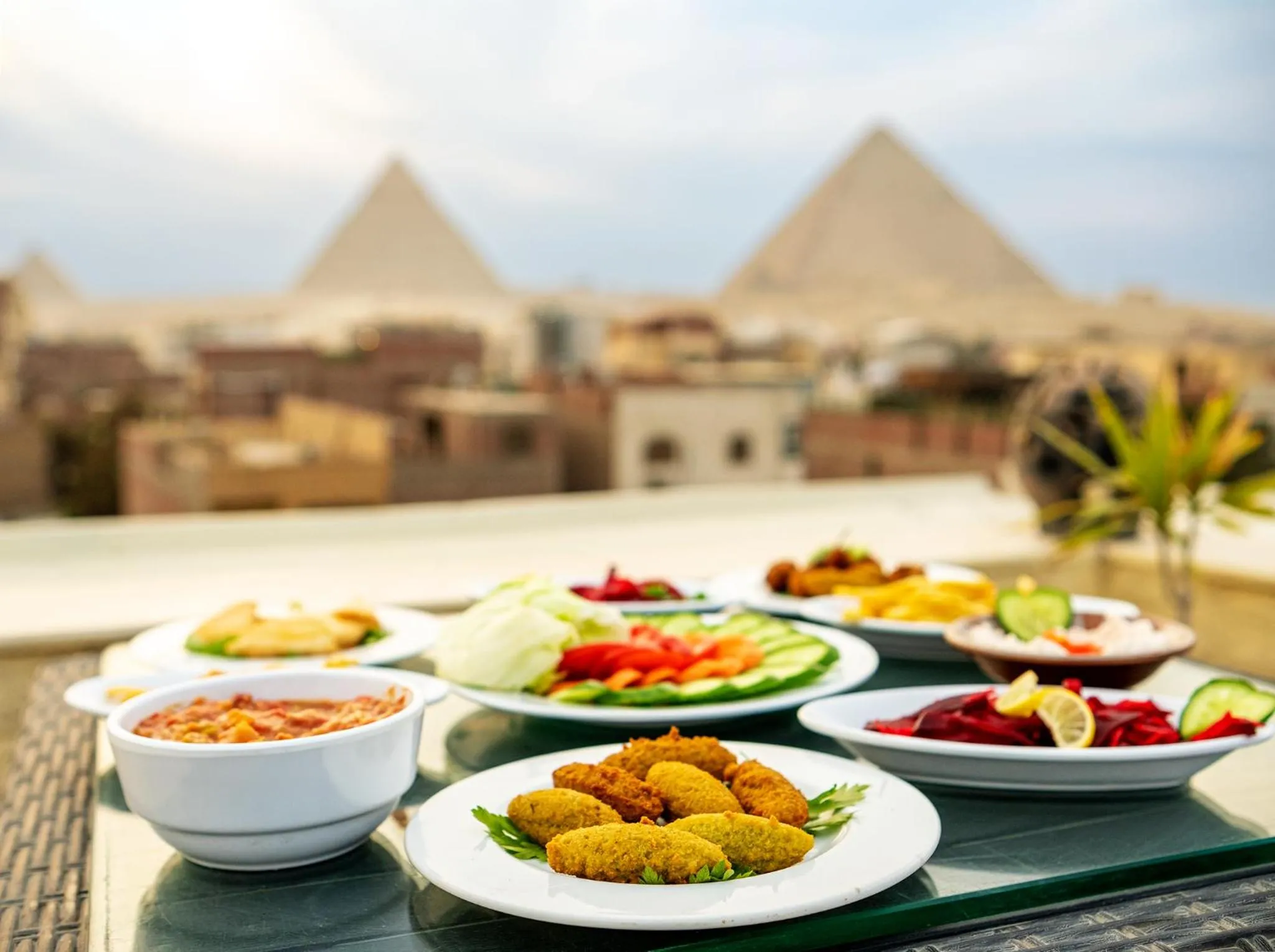 Restaurant/places to eat in Hassan Pyramids Hotel & free access Rooftop & airport pickup