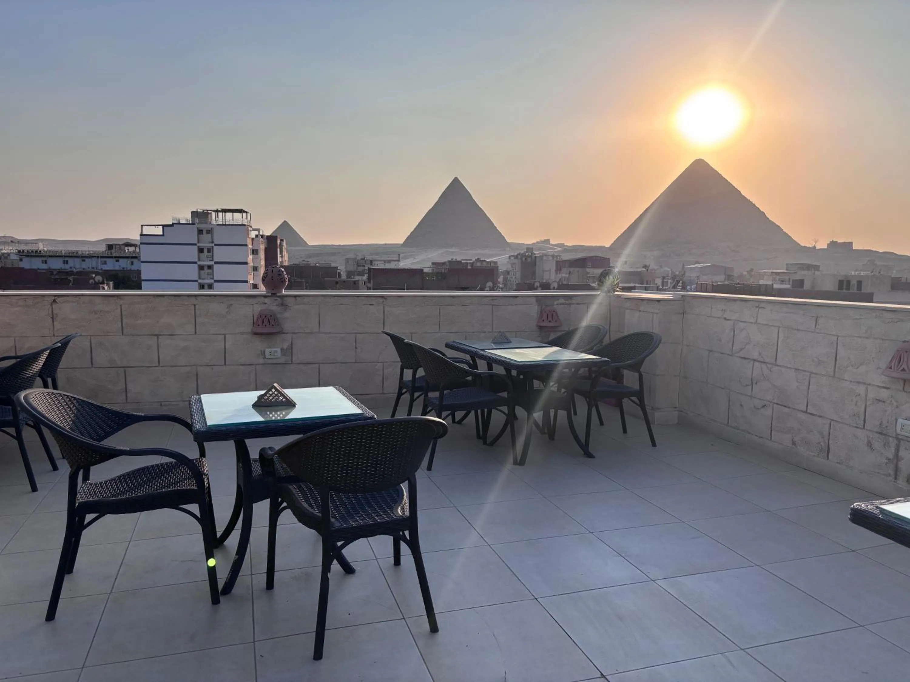 Restaurant/places to eat in Hassan Pyramids Hotel & free access Rooftop & airport pickup