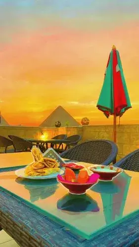 Quadruple Room with Mountain View in Hassan Pyramids Hotel & free access Rooftop & airport pickup Quadruple Room with Mountain View in Hassan Pyramids Hotel & free access Rooftop & airport pickup