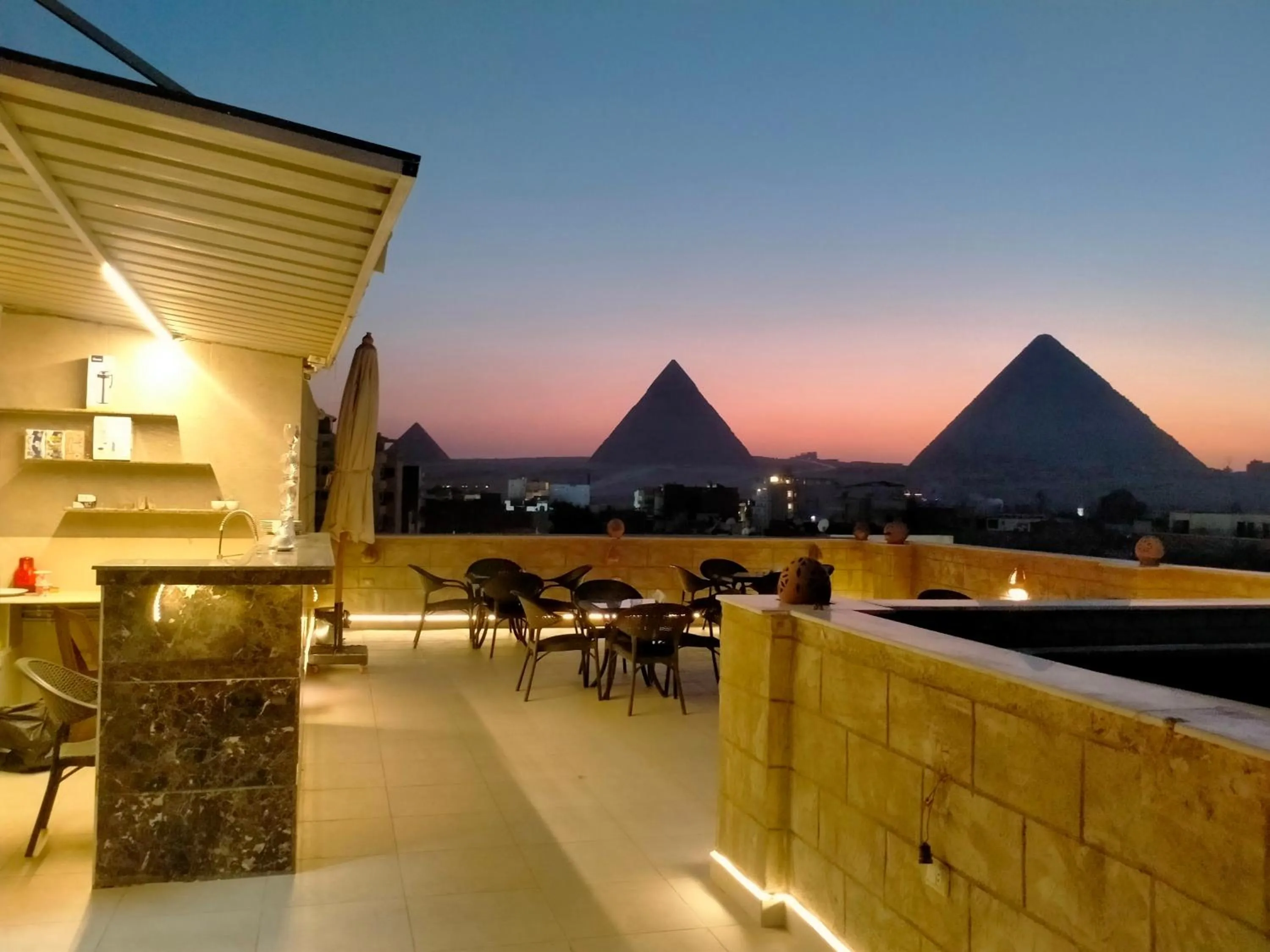 Property building in Hassan Pyramids Hotel & free access Rooftop & airport pickup