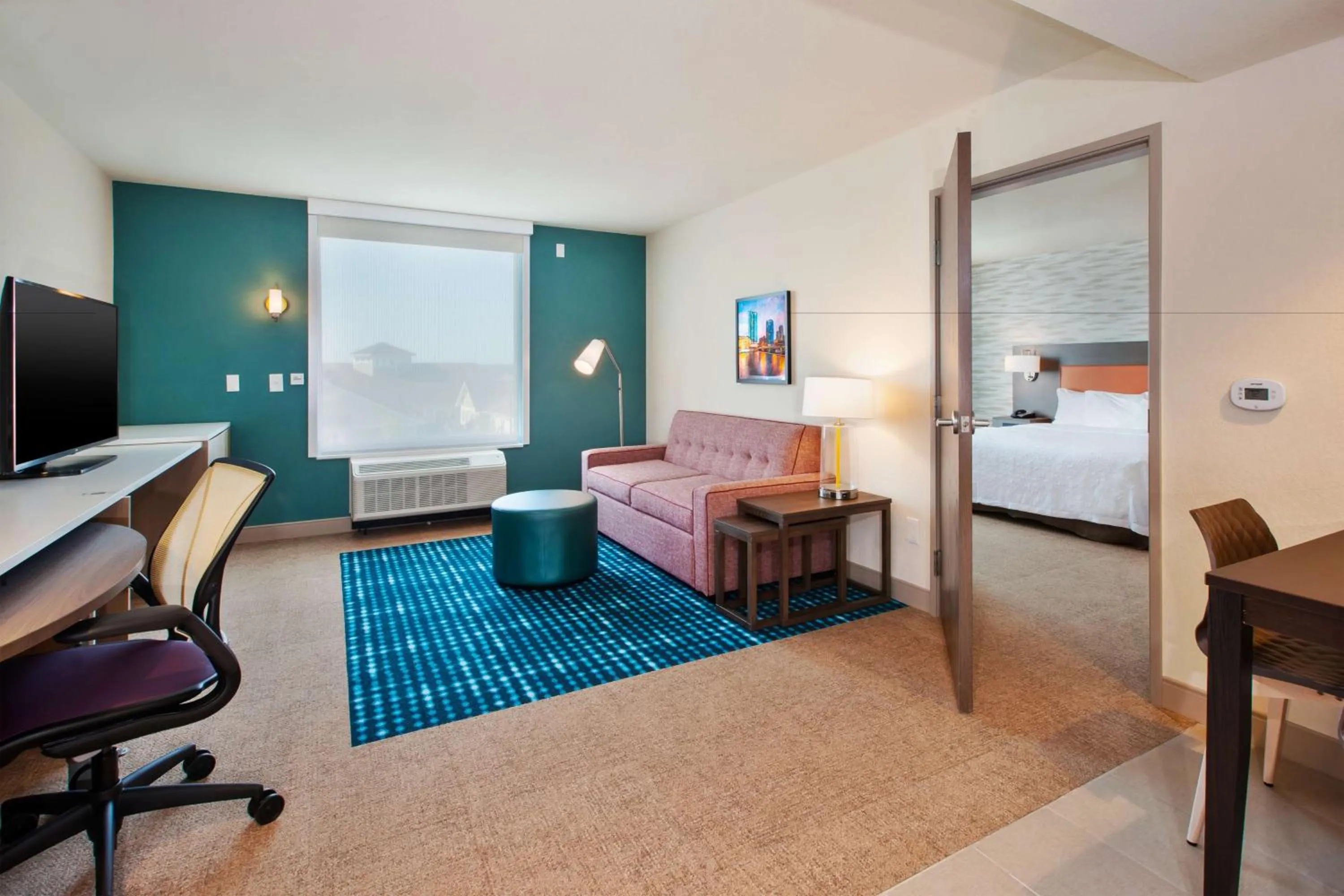 Living room, Bed in Home2 Suites By Hilton Grand Rapids South