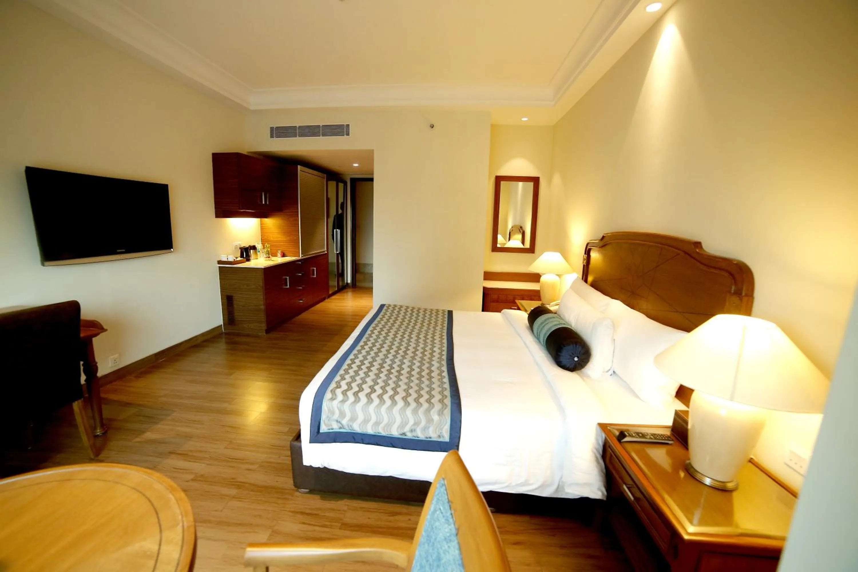 Photo of the whole room, Bed in The Lalit Traveller- Airport hotel