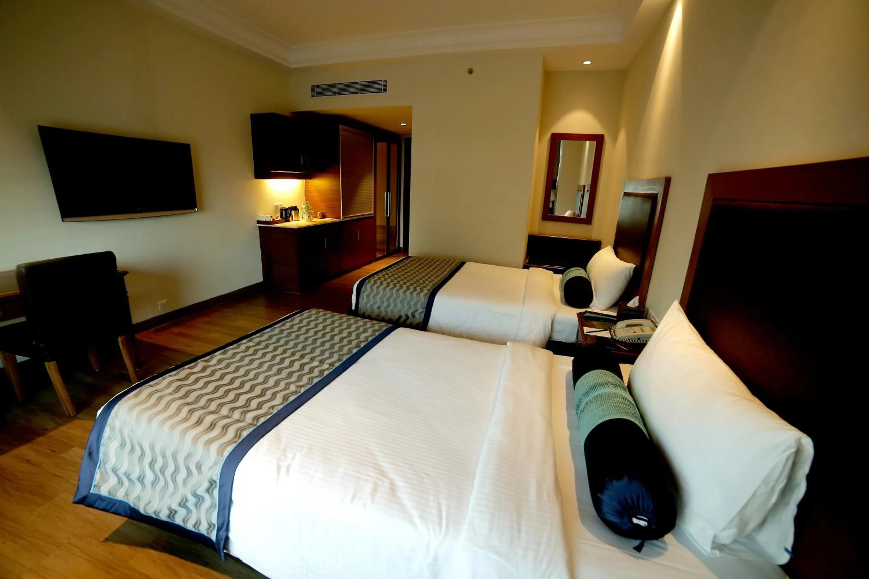 Photo of the whole room, Bed in The Lalit Traveller- Airport hotel
