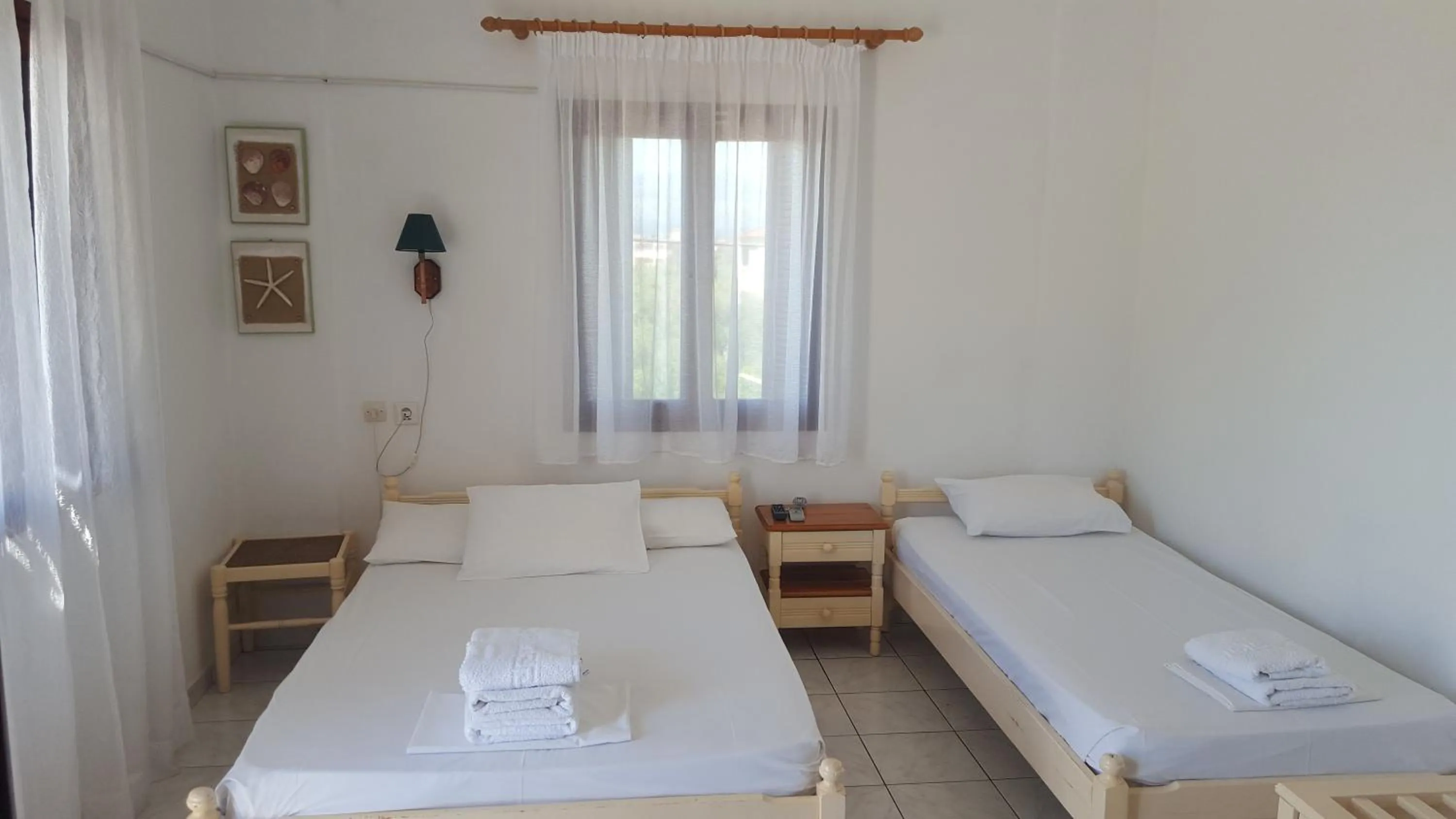 Bed in Aeolos Hotel Apartments