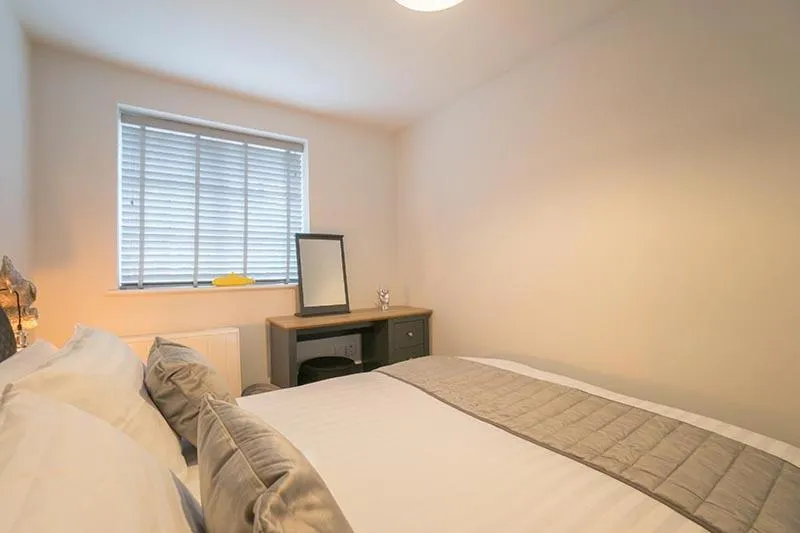 Bed in The Queens Arms Apartments