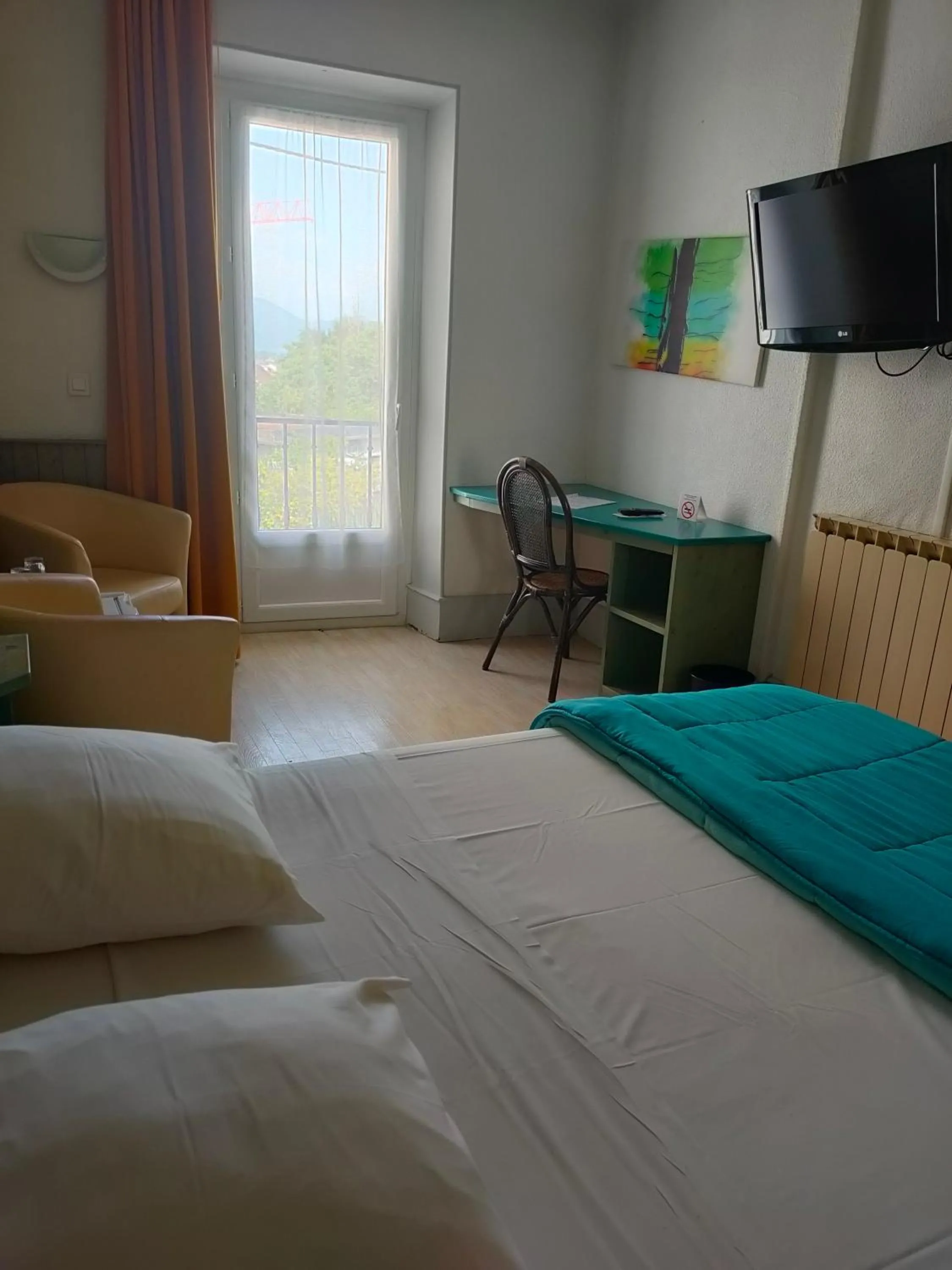 Photo of the whole room, Bed in Hôtel de la Grotte