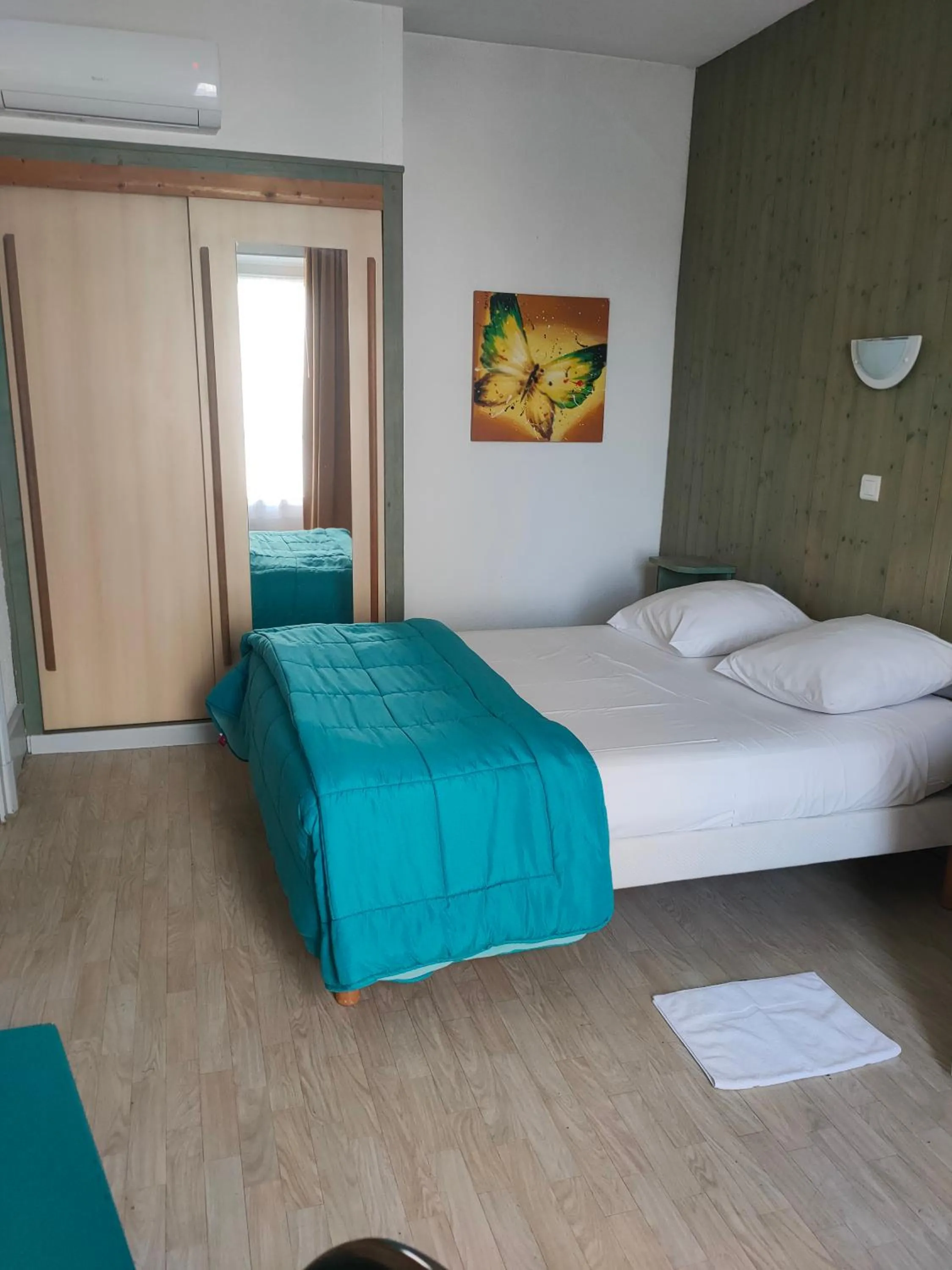 Photo of the whole room, Bed in Hôtel de la Grotte