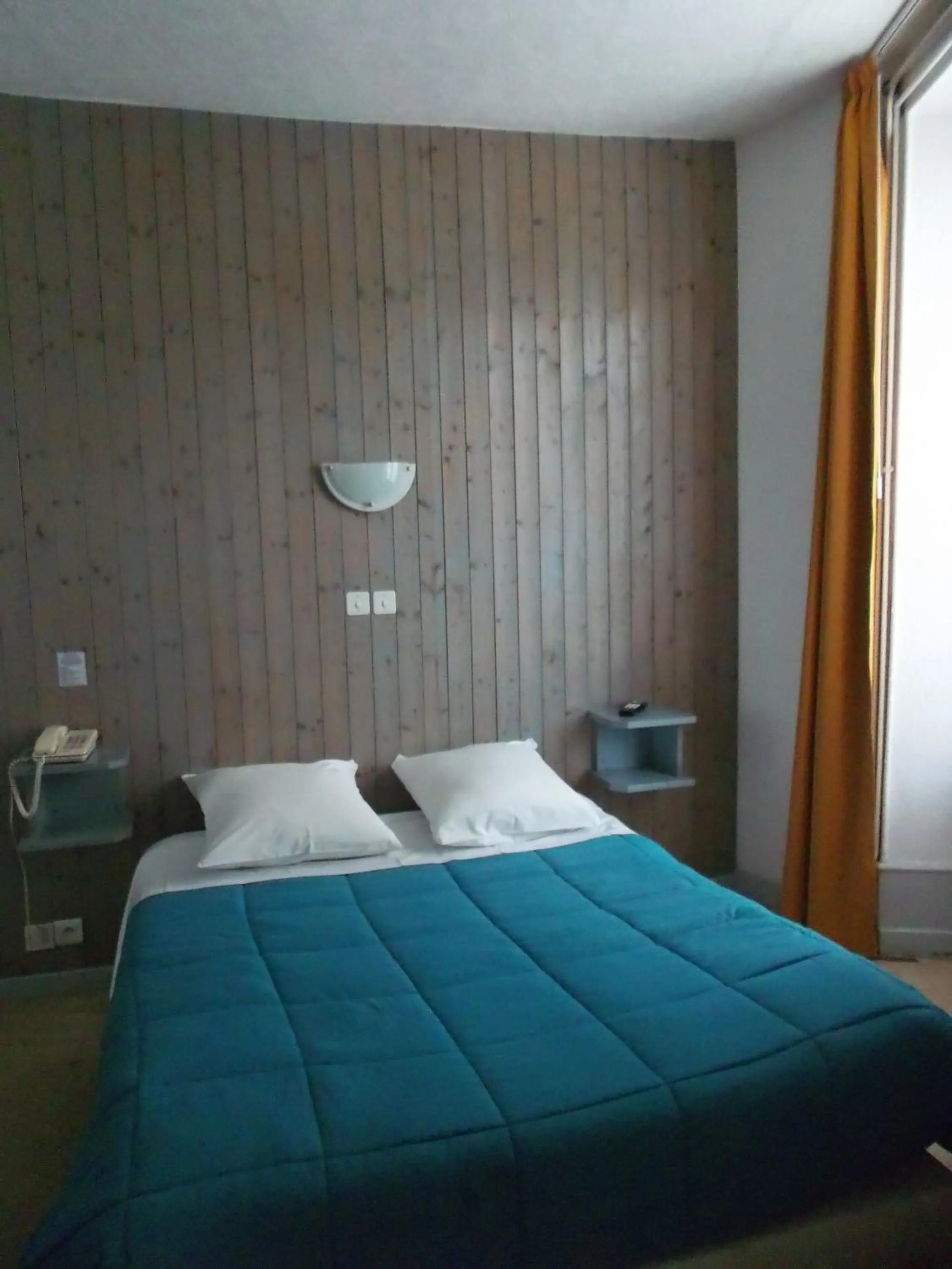 Photo of the whole room, Bed in Hôtel de la Grotte