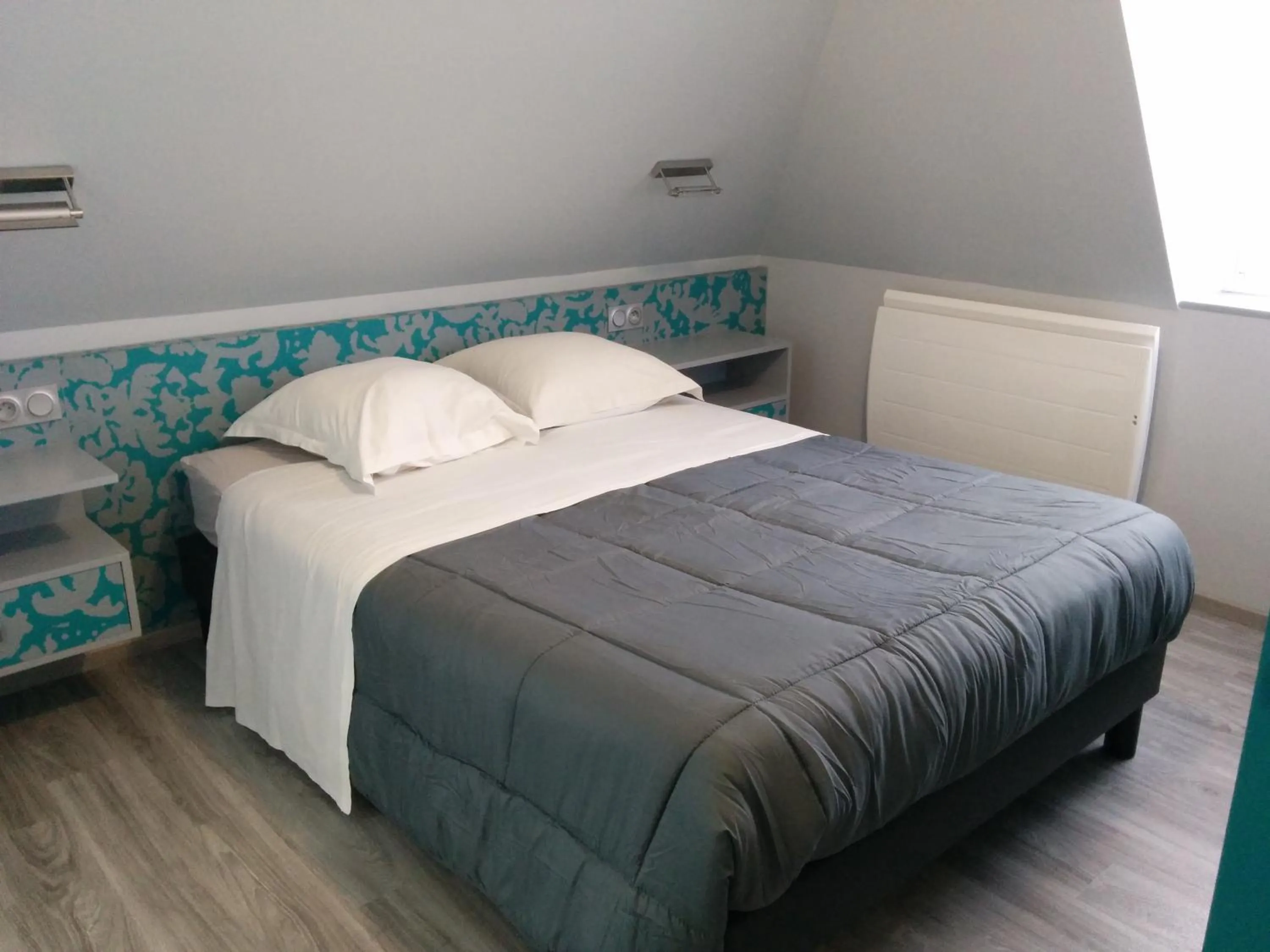 Photo of the whole room, Bed in Hôtel de la Grotte