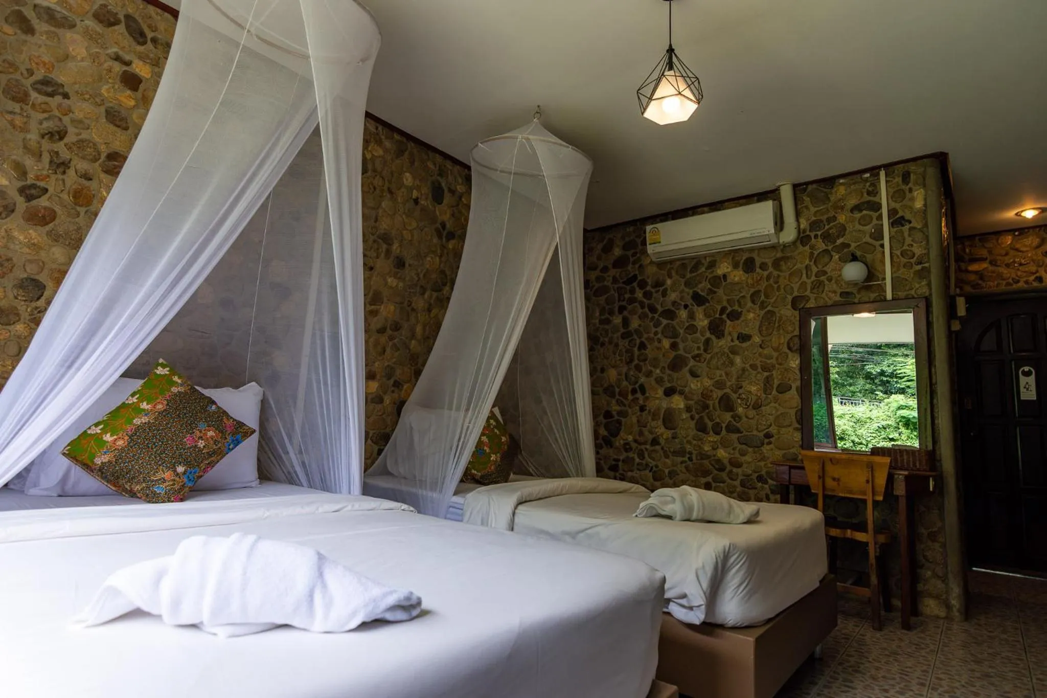 Bed in THANSILA Resort