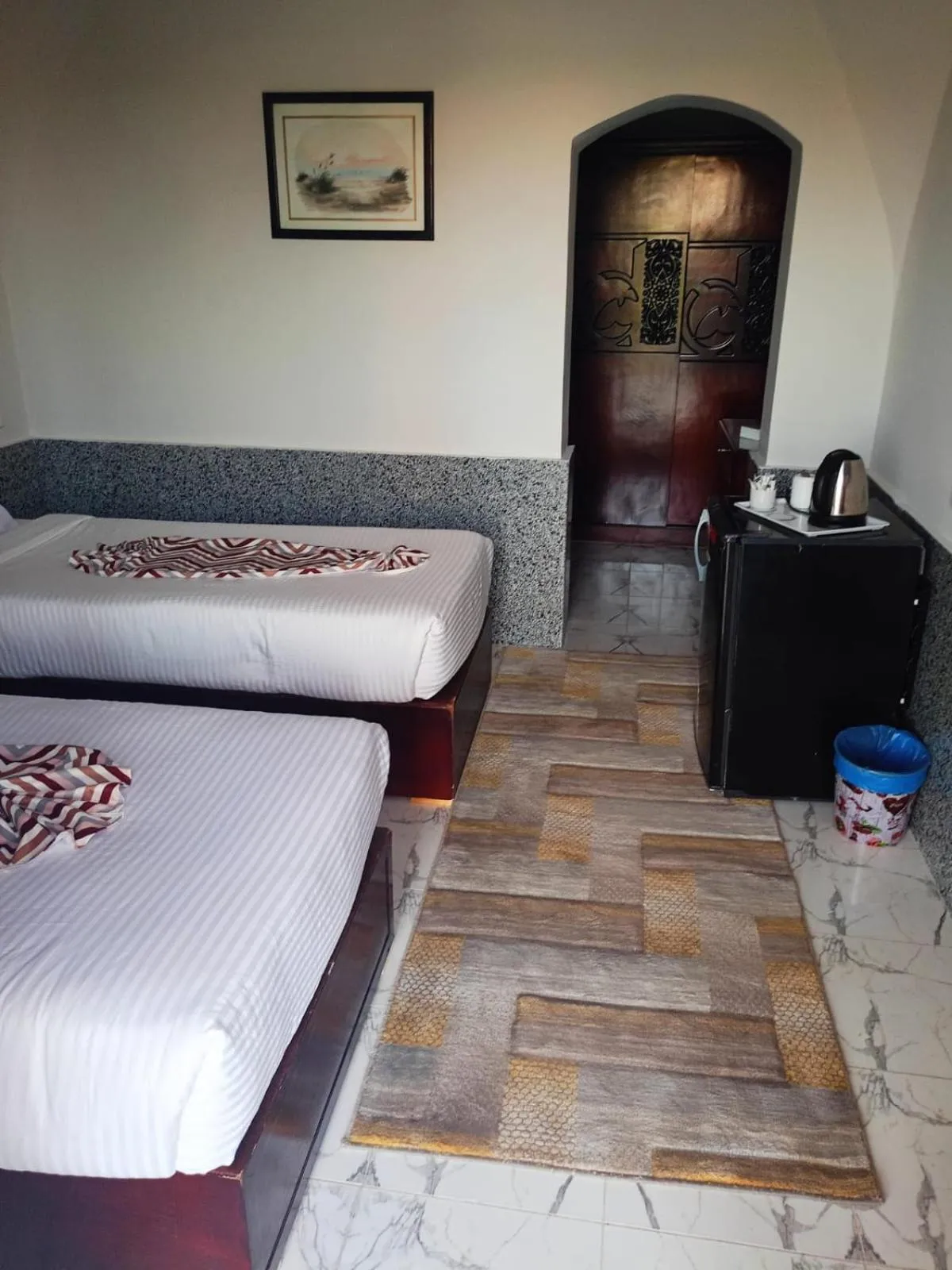 Bed in Dolphin Continental Hotel