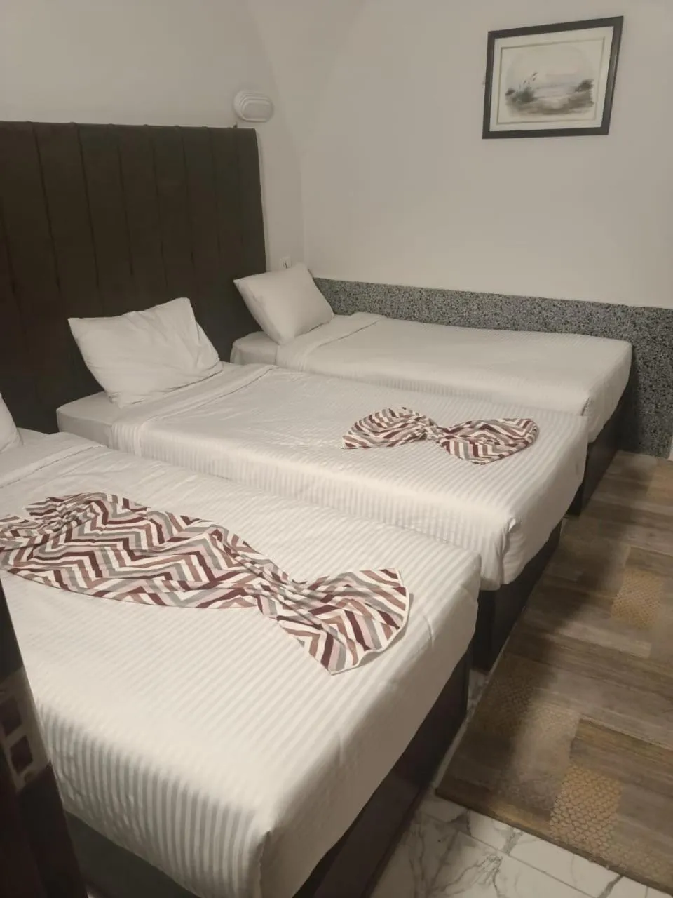 Bed in Dolphin Continental Hotel