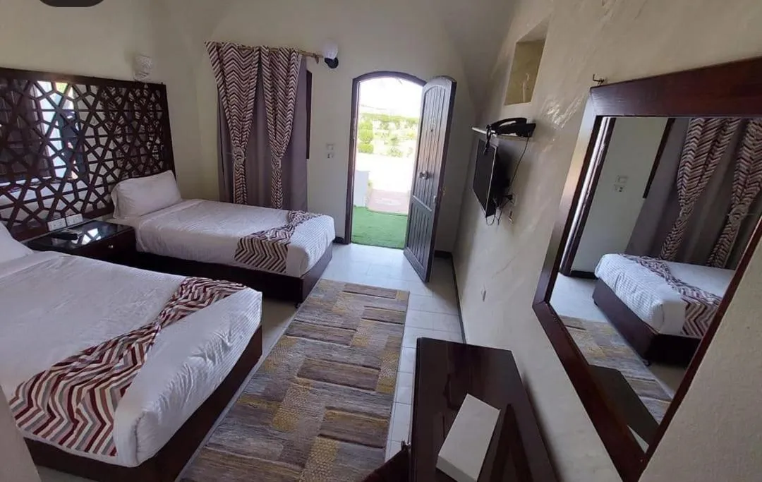 Bed in Dolphin Continental Hotel