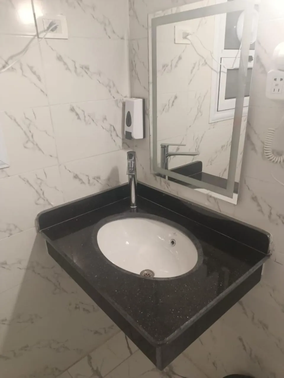 Bathroom in Dolphin Continental Hotel