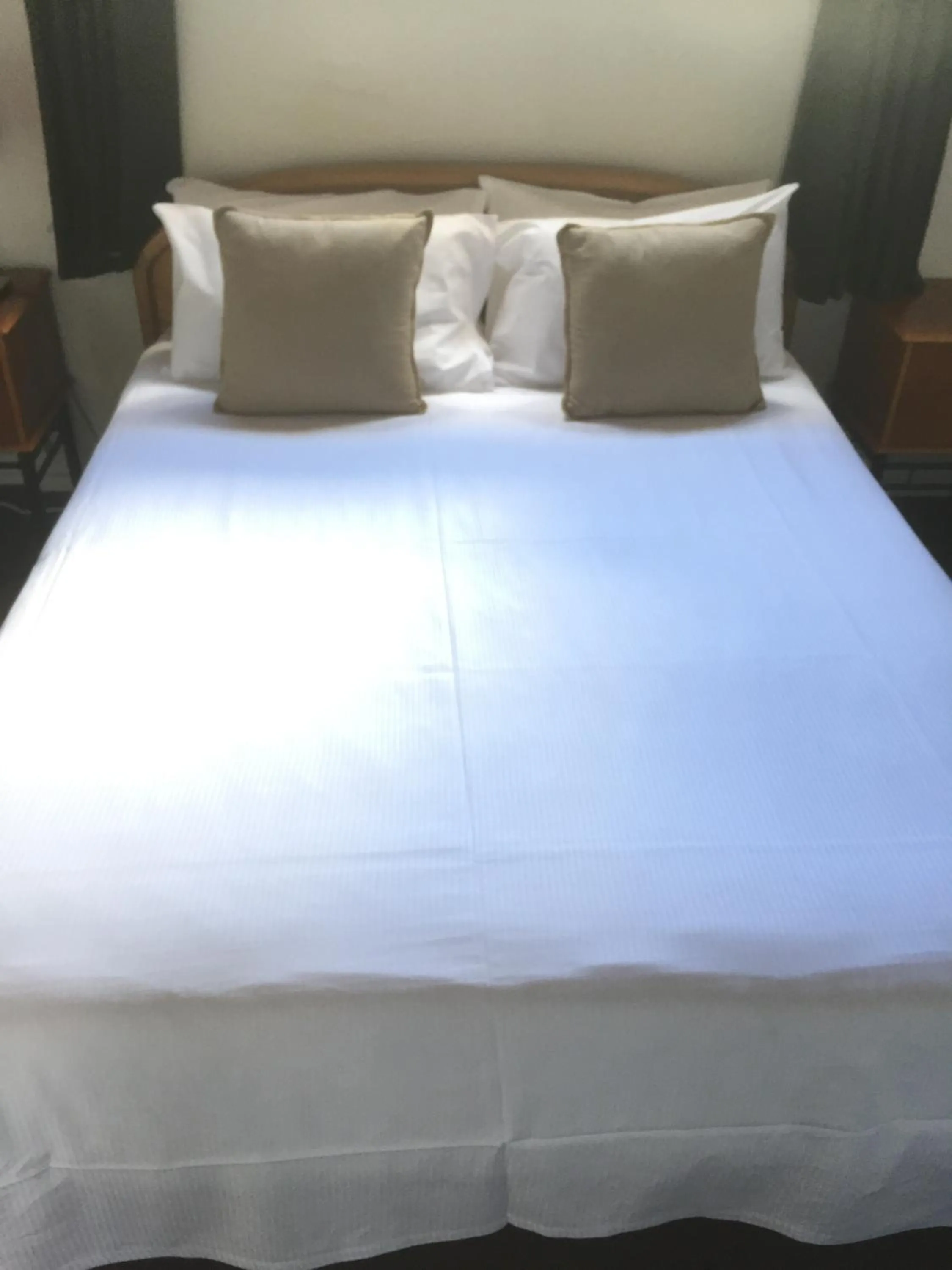 Bed in Orewa Pillows Lodge