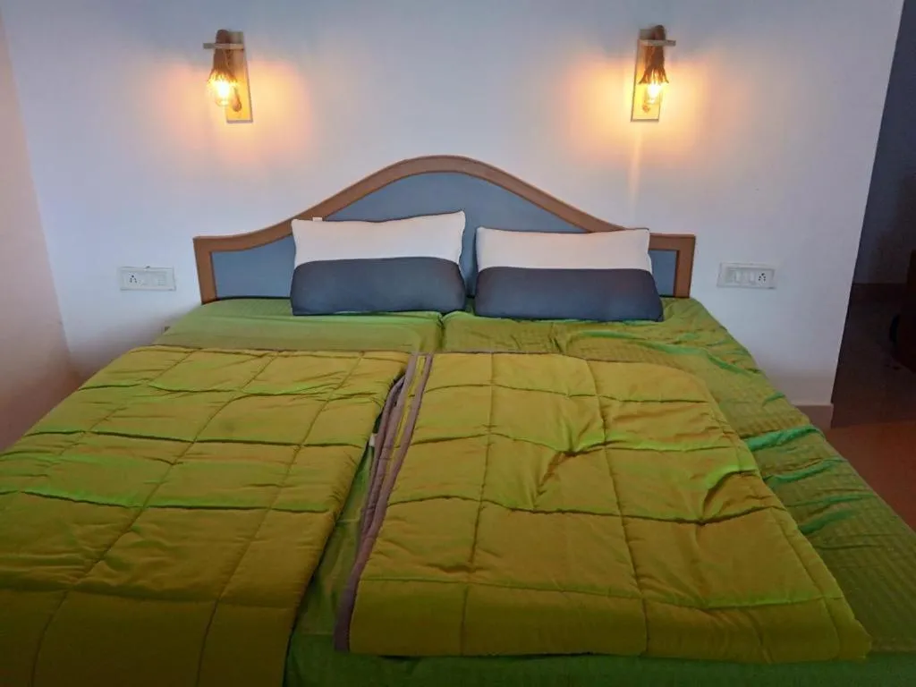 Bed in The Nirvana Resort Munnar