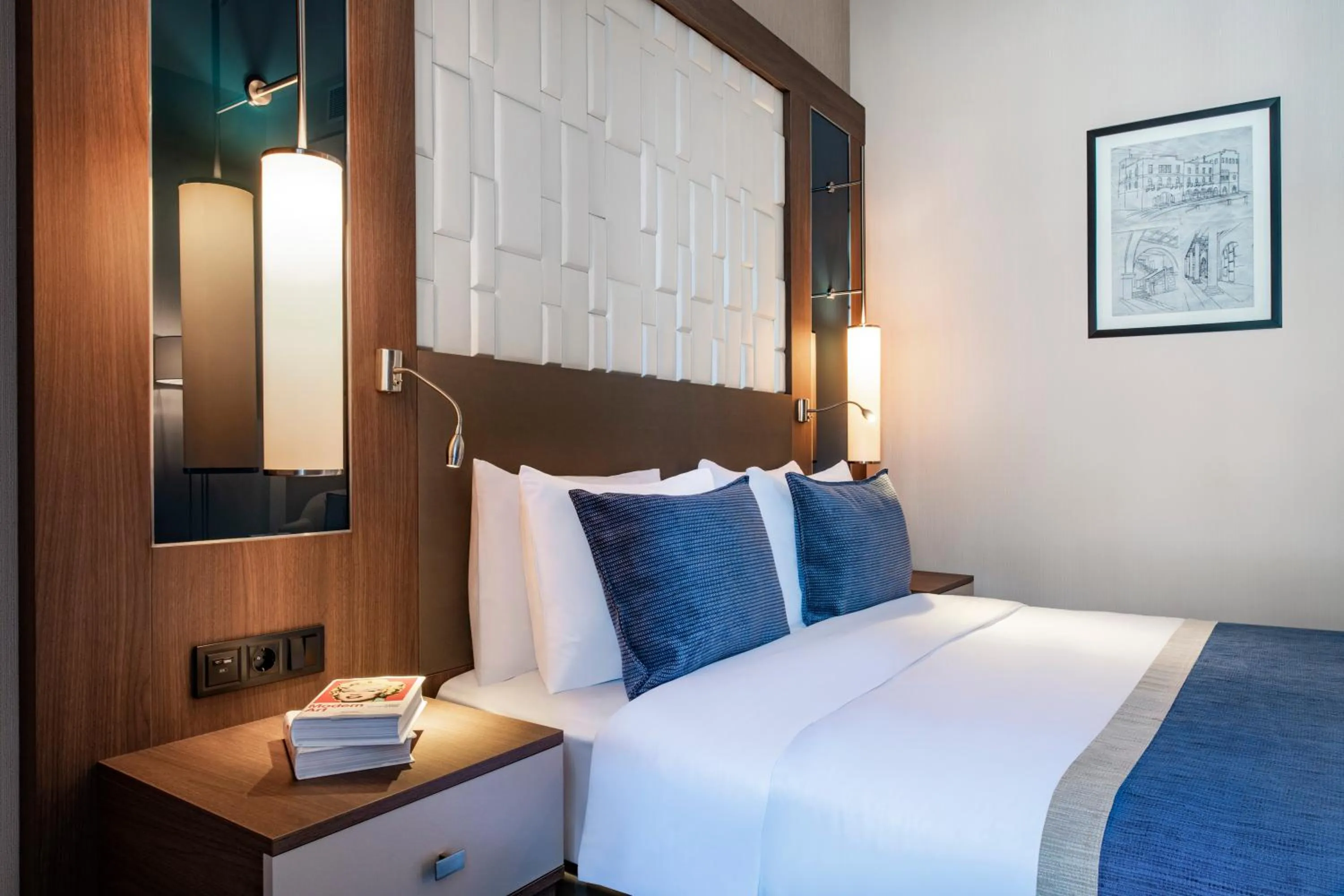 Bed in Tbilisi Philharmonic Hotel by Mercure