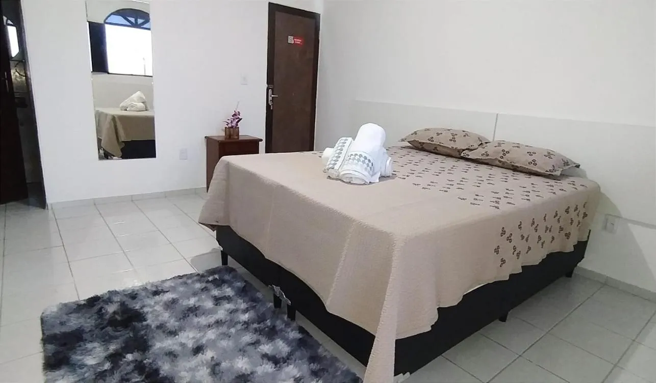 Bed in POUSADA VENTO NORTE CAMA & CAFÉ SUÍTES INDIVIDUAIs