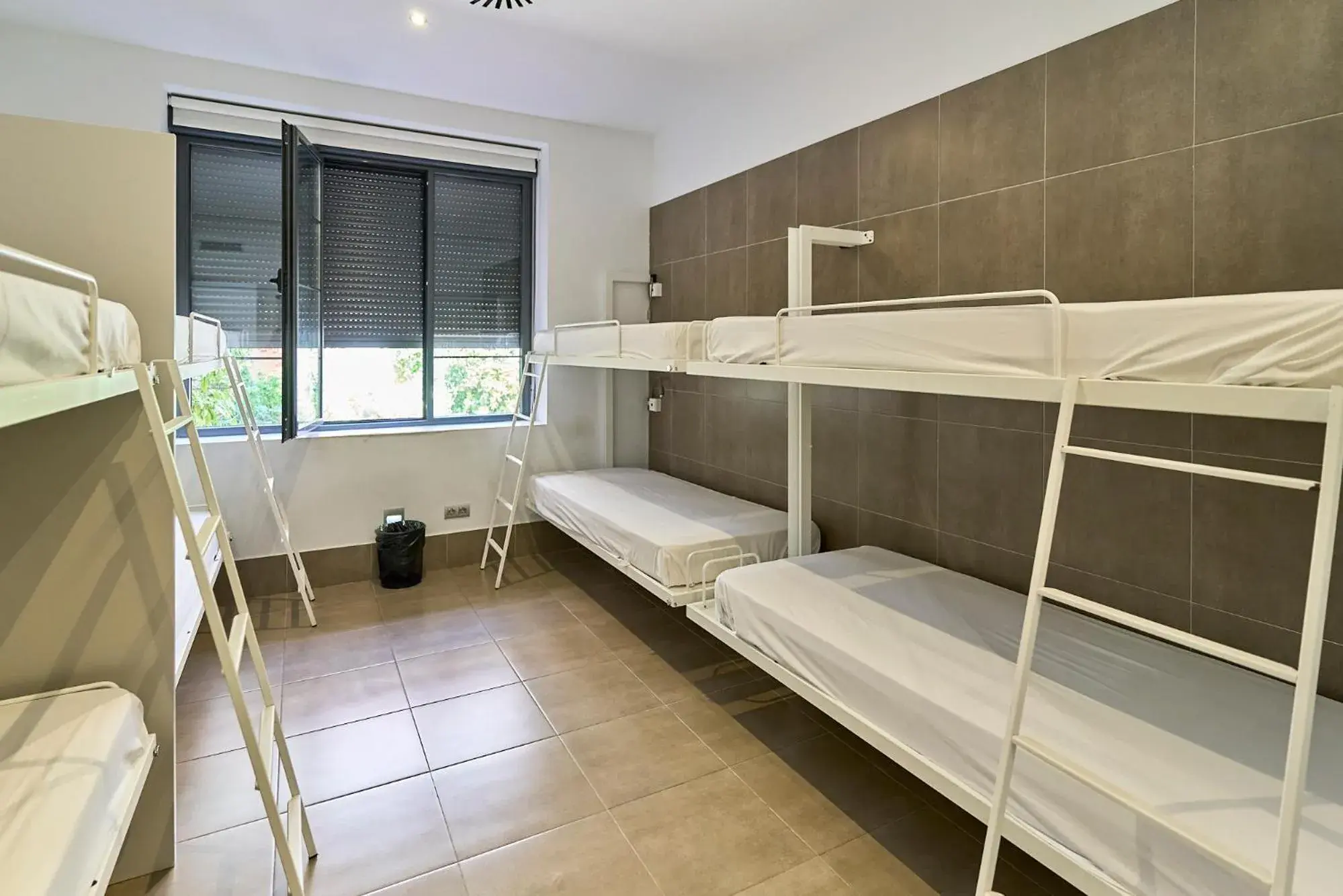 Single Bed in Dormitory Room in The Book Factory Hostel by gaiarooms Single Bed in Dormitory Room in The Book Factory Hostel by gaiarooms
