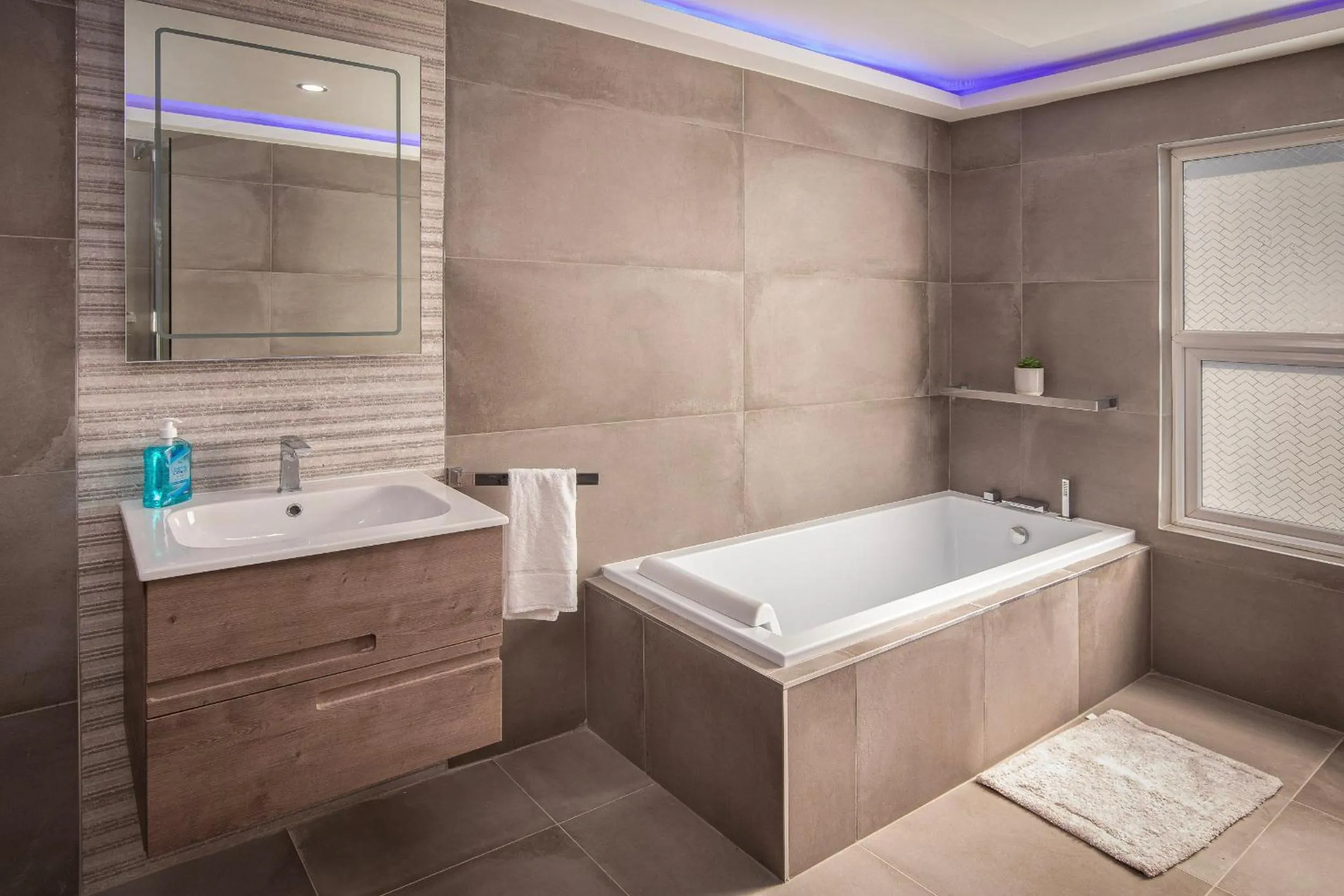 Bathroom in Town View Apartment by Sasco