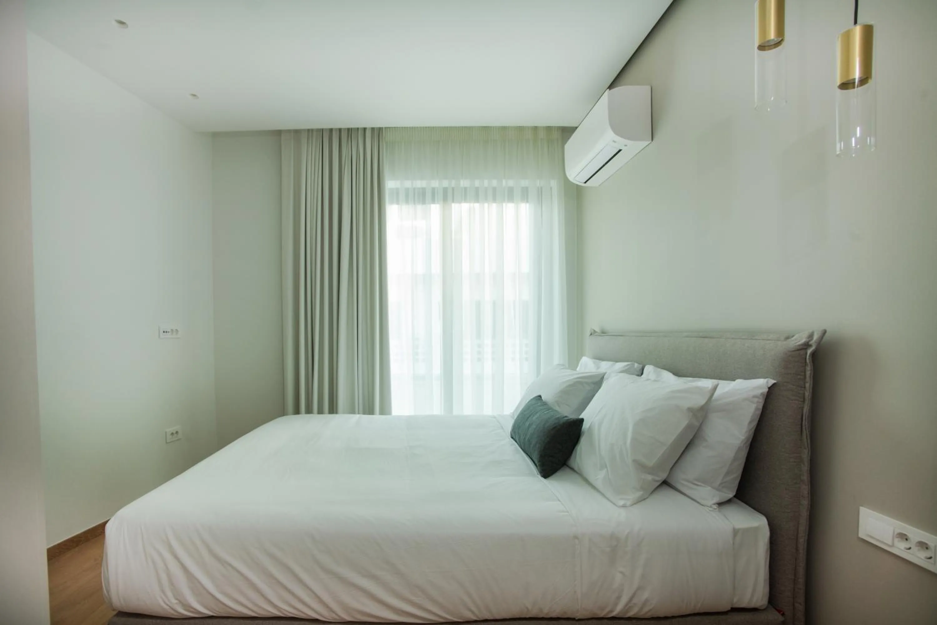 Bed in Celine Luxury Apartments & Suites