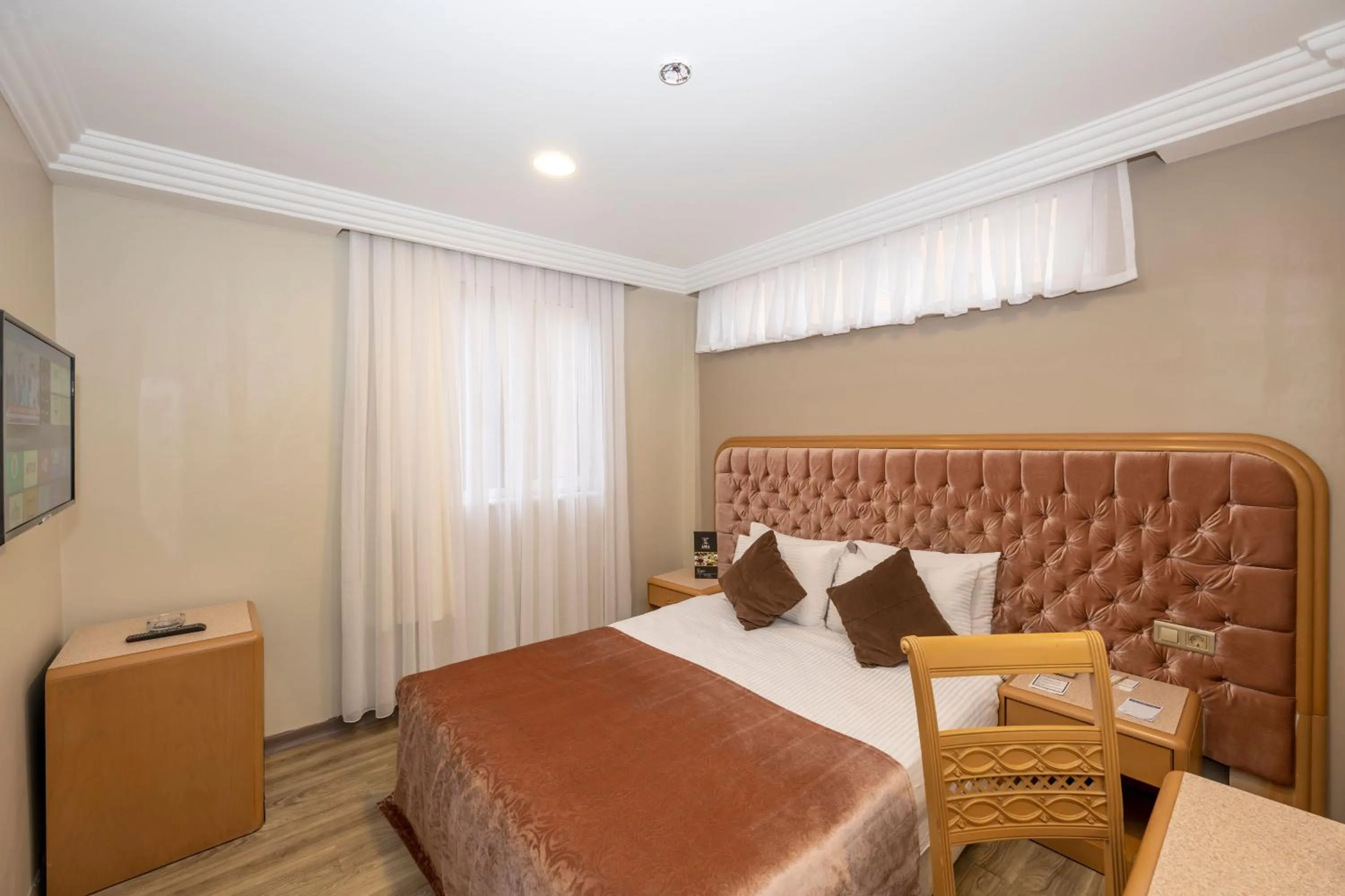 Bed in Grand Anka Hotel