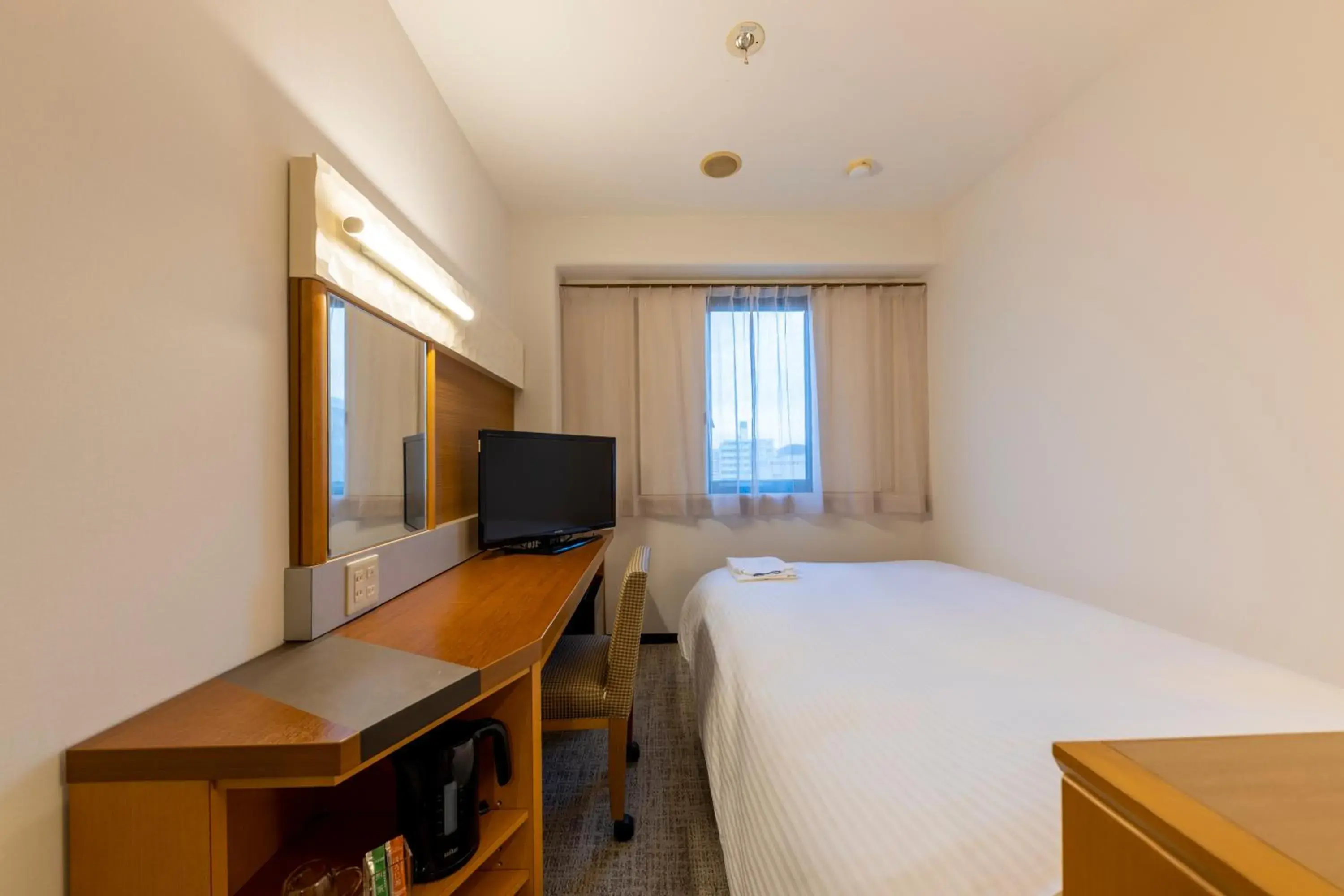 Bed in JR CLEMENT INN HIMEJI Bed in JR CLEMENT INN HIMEJI