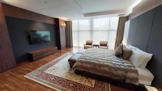 Bed in High1 Grand Hotel Convention Tower