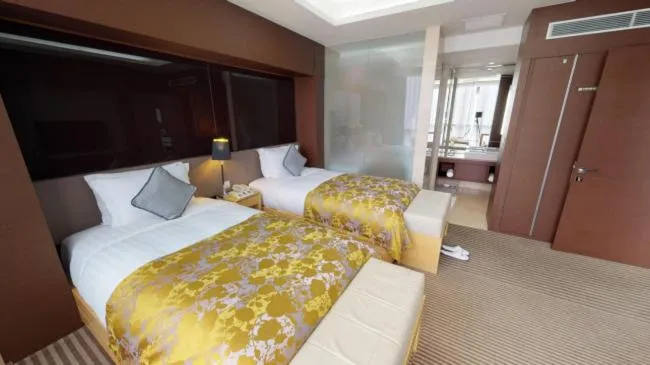 Bed in High1 Grand Hotel Convention Tower
