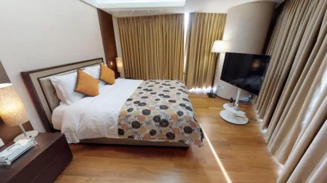 Bed in High1 Grand Hotel Convention Tower